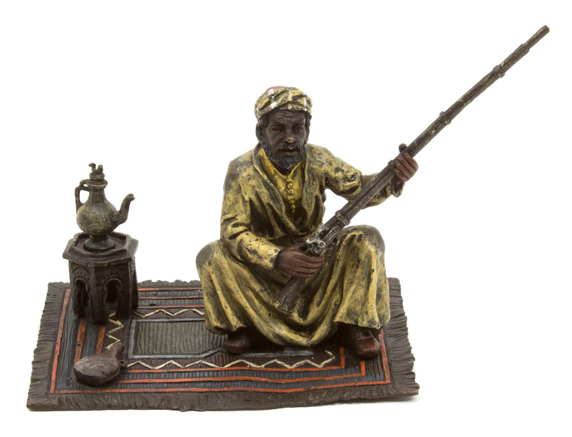 Nam Greb (Franz Bergmann), (Austrian, 1861-1936), Man with a Gun Seated on Rug