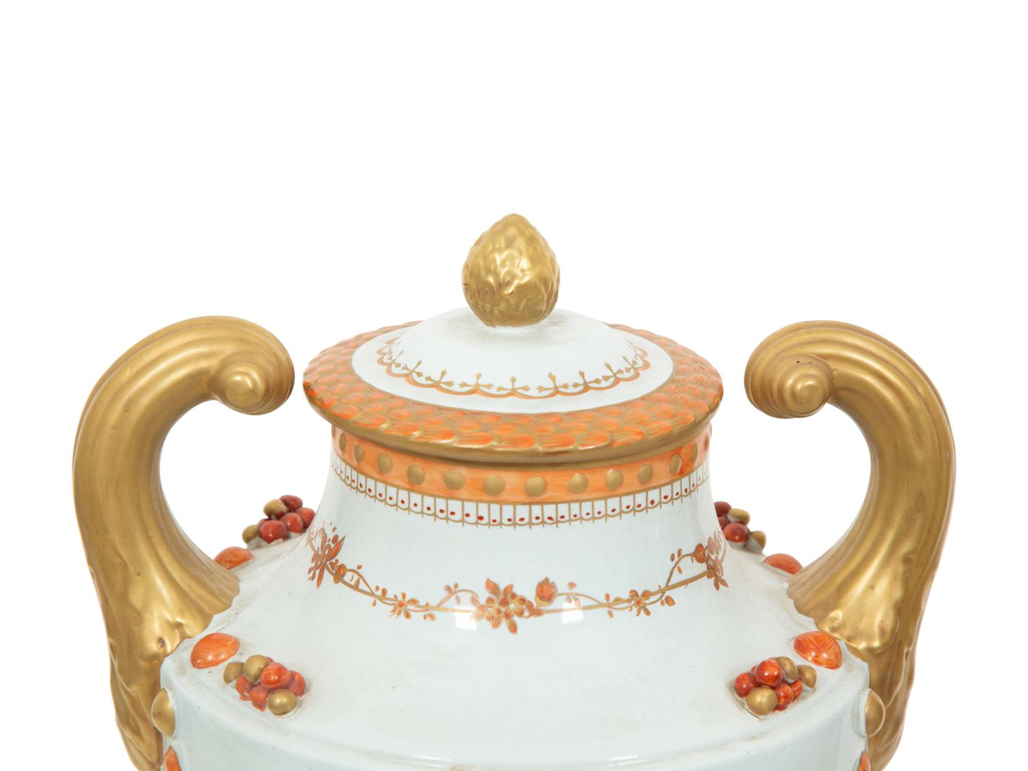 A Pair of Neoclassical Style Porcelain Urns with Bell Flower Swags