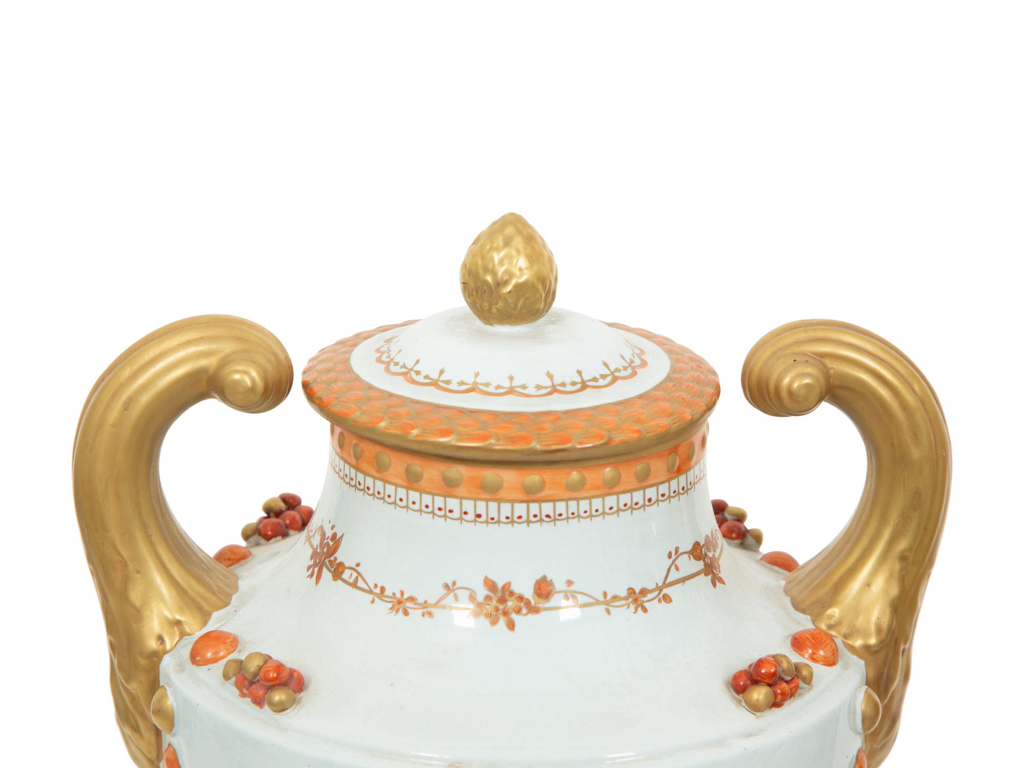 A Pair of Neoclassical Style Porcelain Urns with Bell Flower Swags