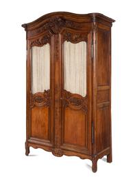 A Louis XV Provincial Style Carved Walnut Armoire