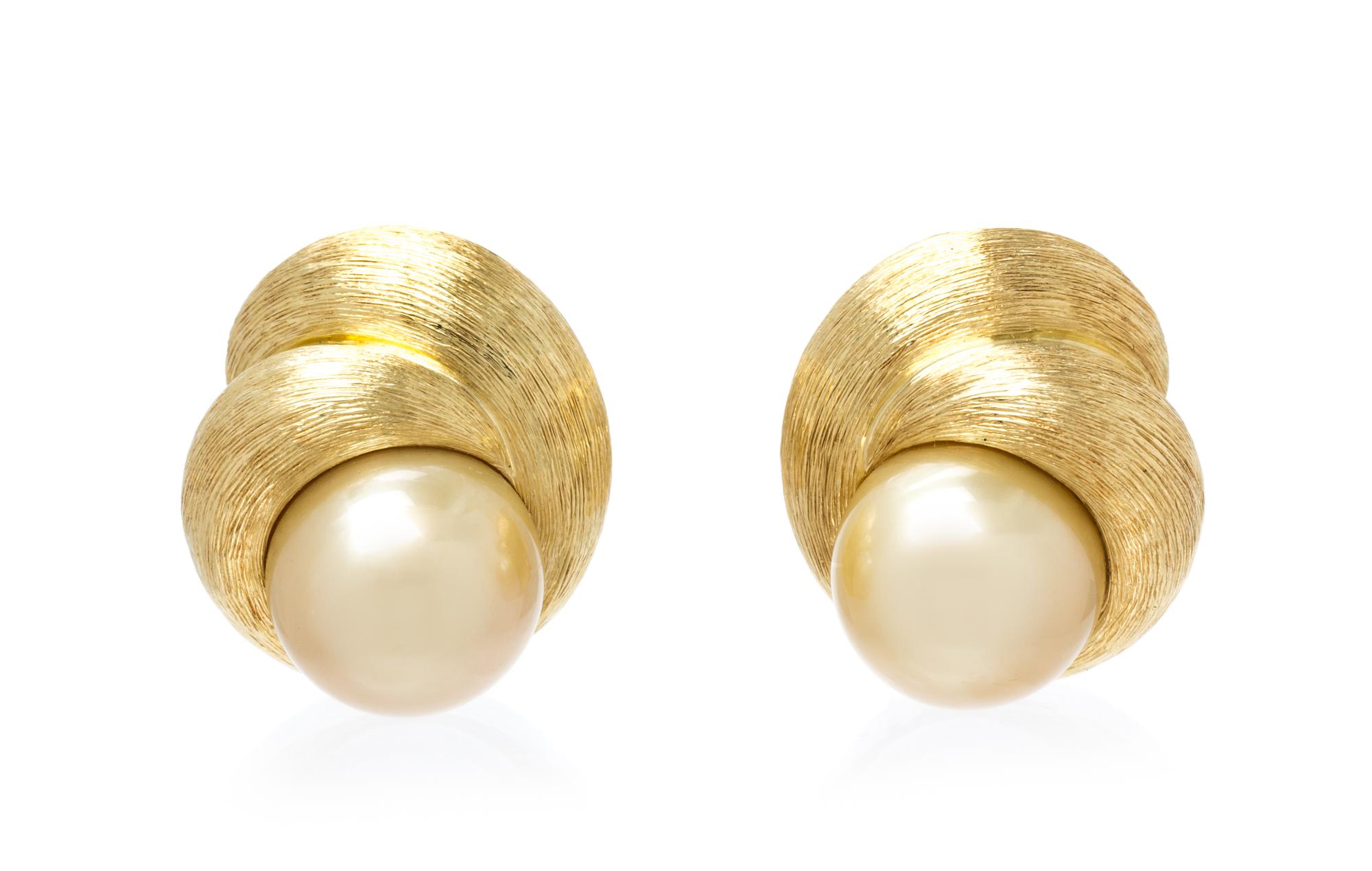 A Pair of 18 Karat Yellow Gold and Cultured Golden South Sea Pearl Earclips, Henry Dunay, 22.90 dwts.