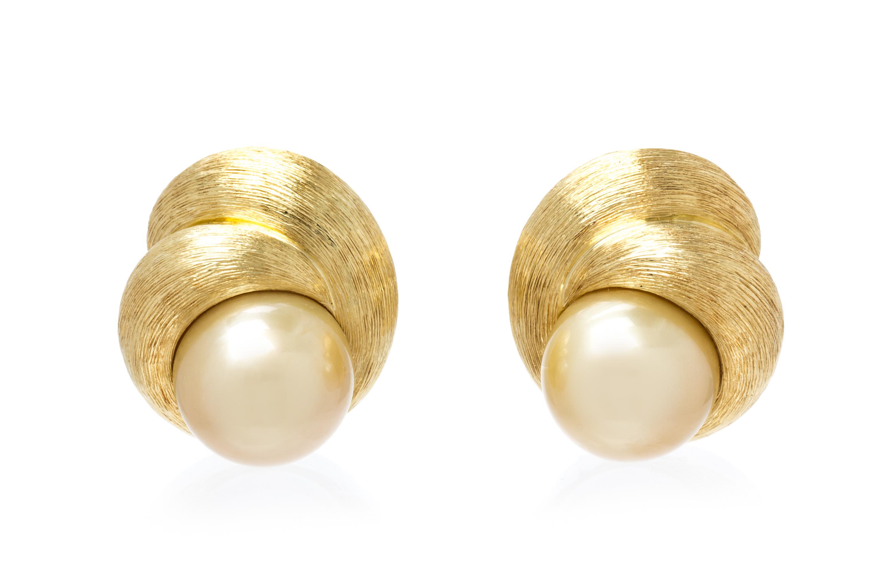 A Pair of 18 Karat Yellow Gold and Cultured Golden South Sea Pearl Earclips, Henry Dunay, 22.90 dwts.