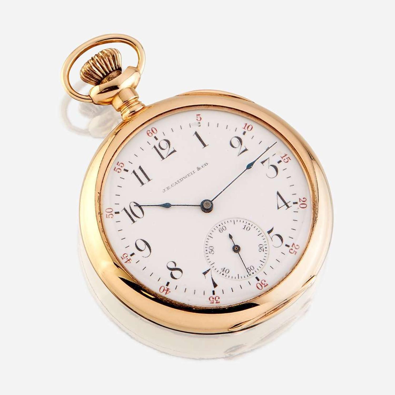 A fourteen karat gold open face pocket watch, Waltham, retailed by J.E. Caldwell