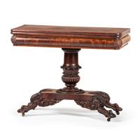 A Classical Carved Mahogany Claw-Foot Game Table