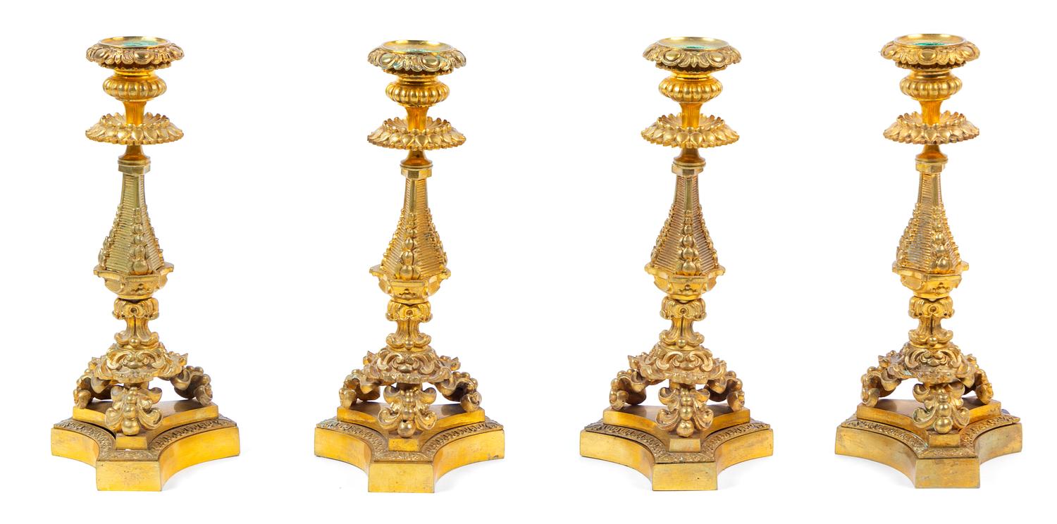 Four French Gilt Bronze Candlesticks Height 11 5/8 inches. — 19TH CENTURY