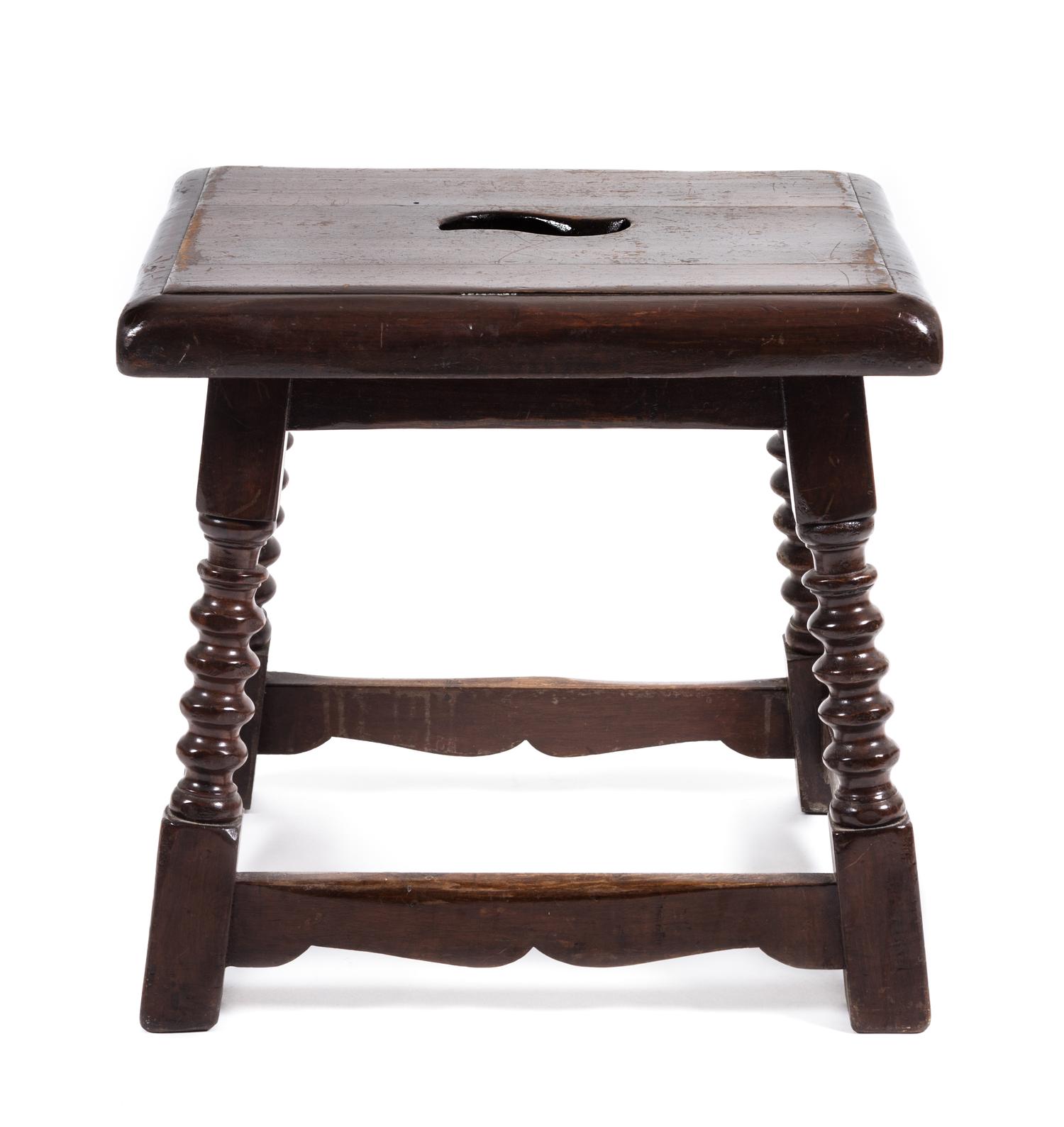 A Jacobean Style Walnut Stool Height 17 x width 17 1/2 x depth 14 inches.