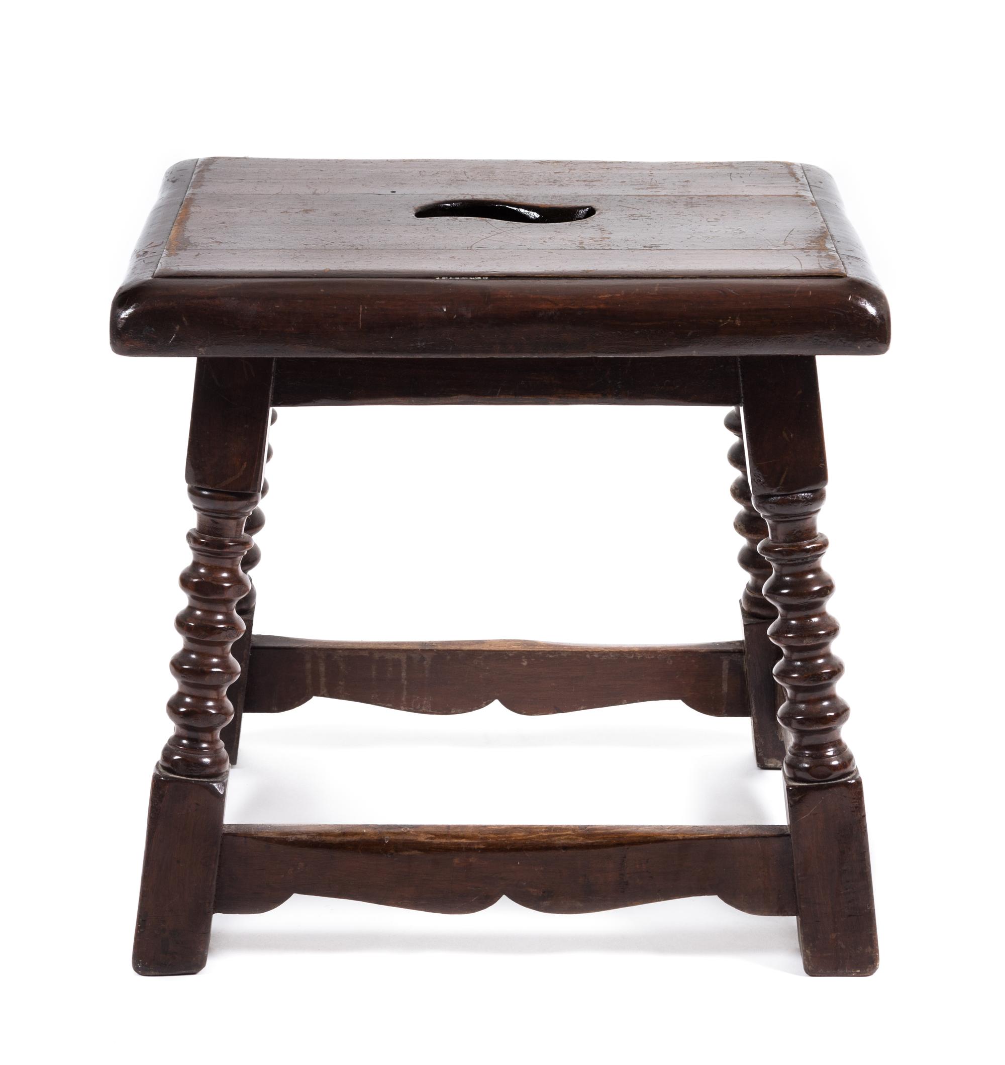 A Jacobean Style Walnut Stool Height 17 x width 17 1/2 x depth 14 inches.