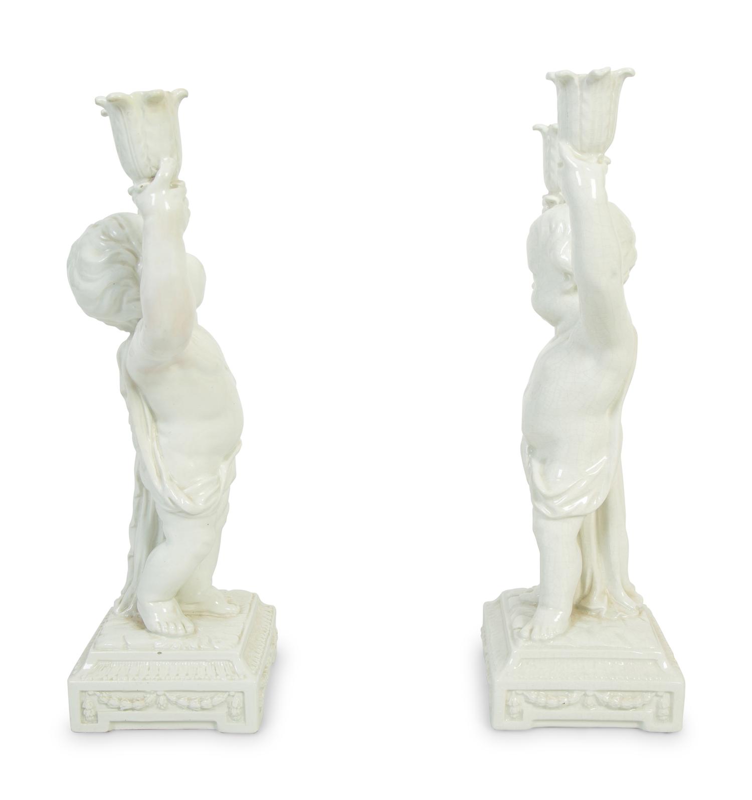 A Pair of Italian Creamware Figural Candelabra