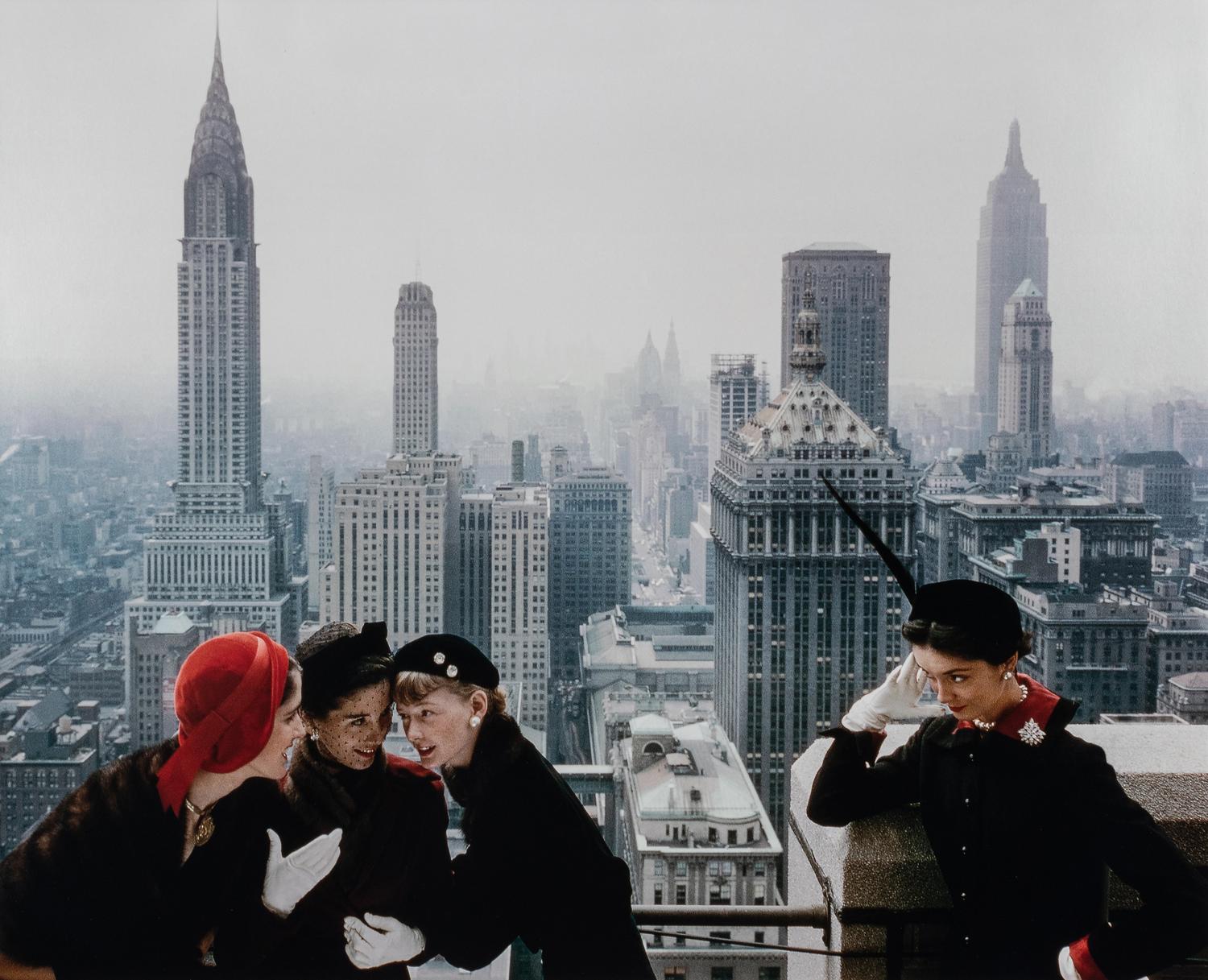 Norman Parkinson (1913-1990) Young Velvets, Young Prices, Hat Fashions, for British "Vogue" (The New York skyline from the roof of the Condé Nast building on Lexington Avenue, New York City), 1949