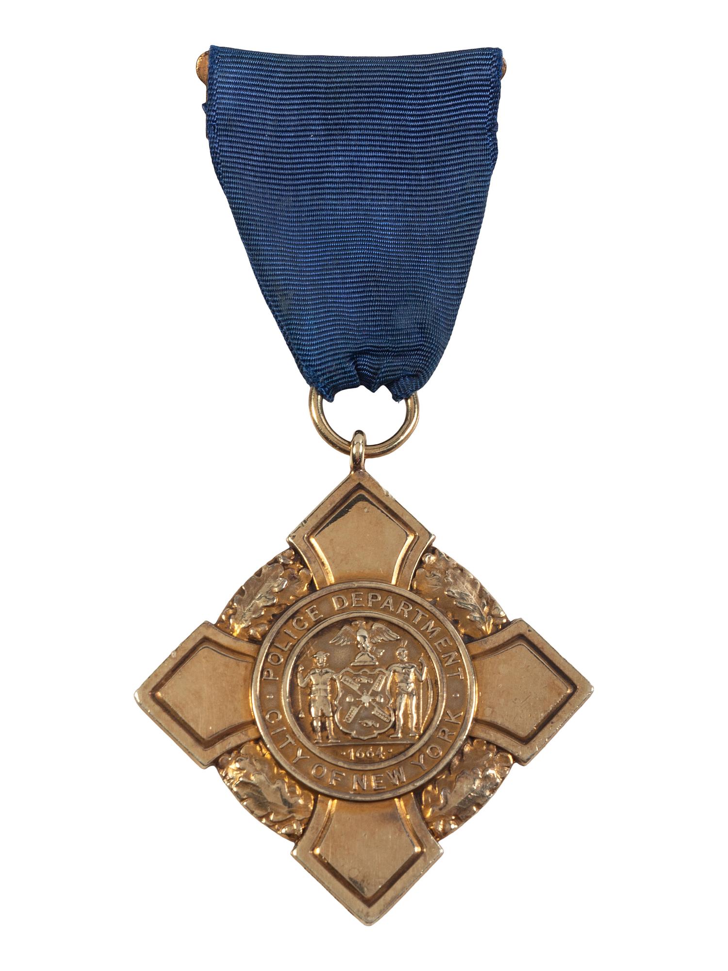 [OCCUPATIONAL]. National Surety Medal for Valor presented to African American police officer Leslie H. Carroll. New York: Tiffany & Co., 1943.