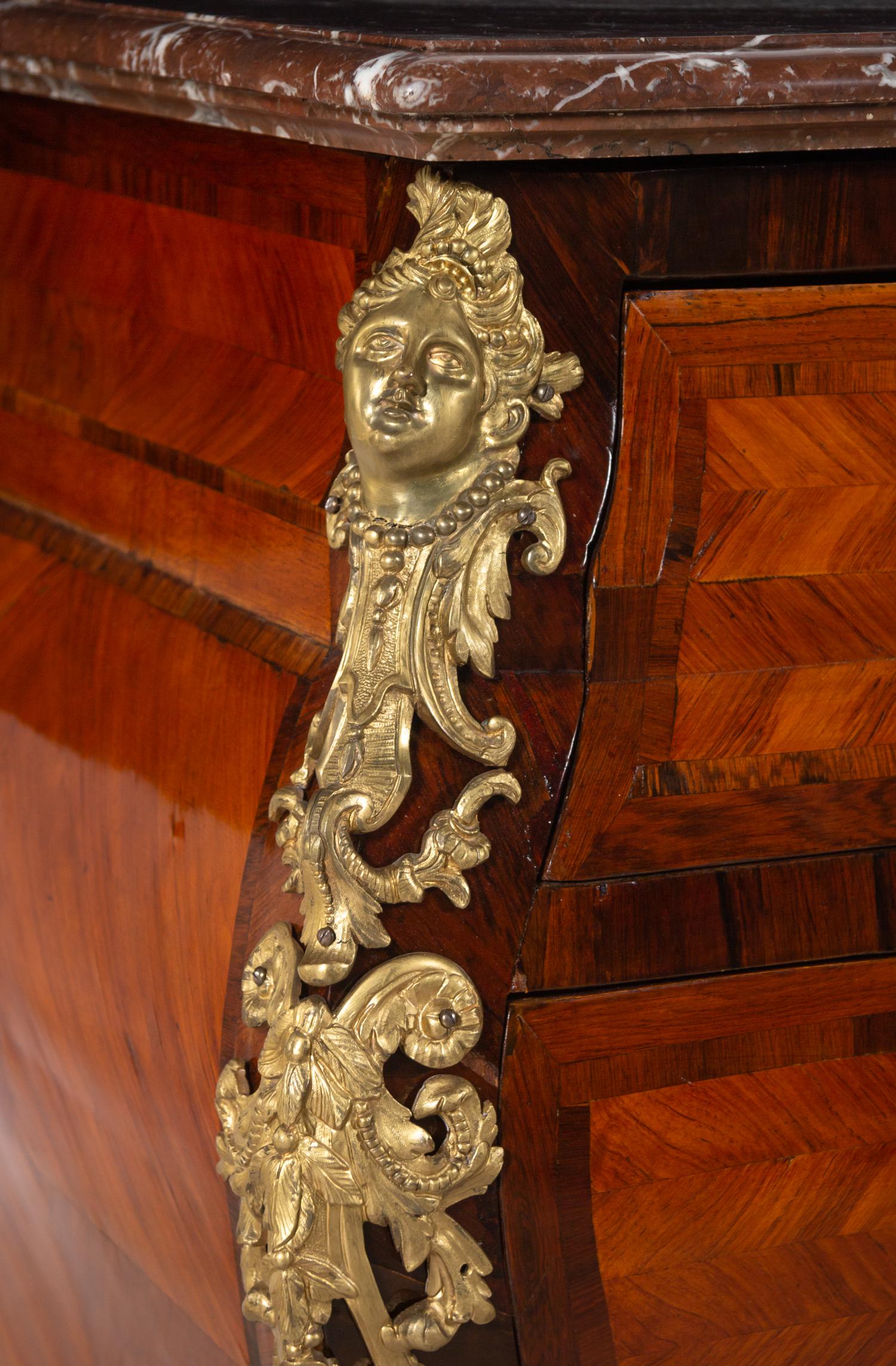 A Régence Style Gilt Bronze Mounted Parquetry Marble-Top Bombe Commode