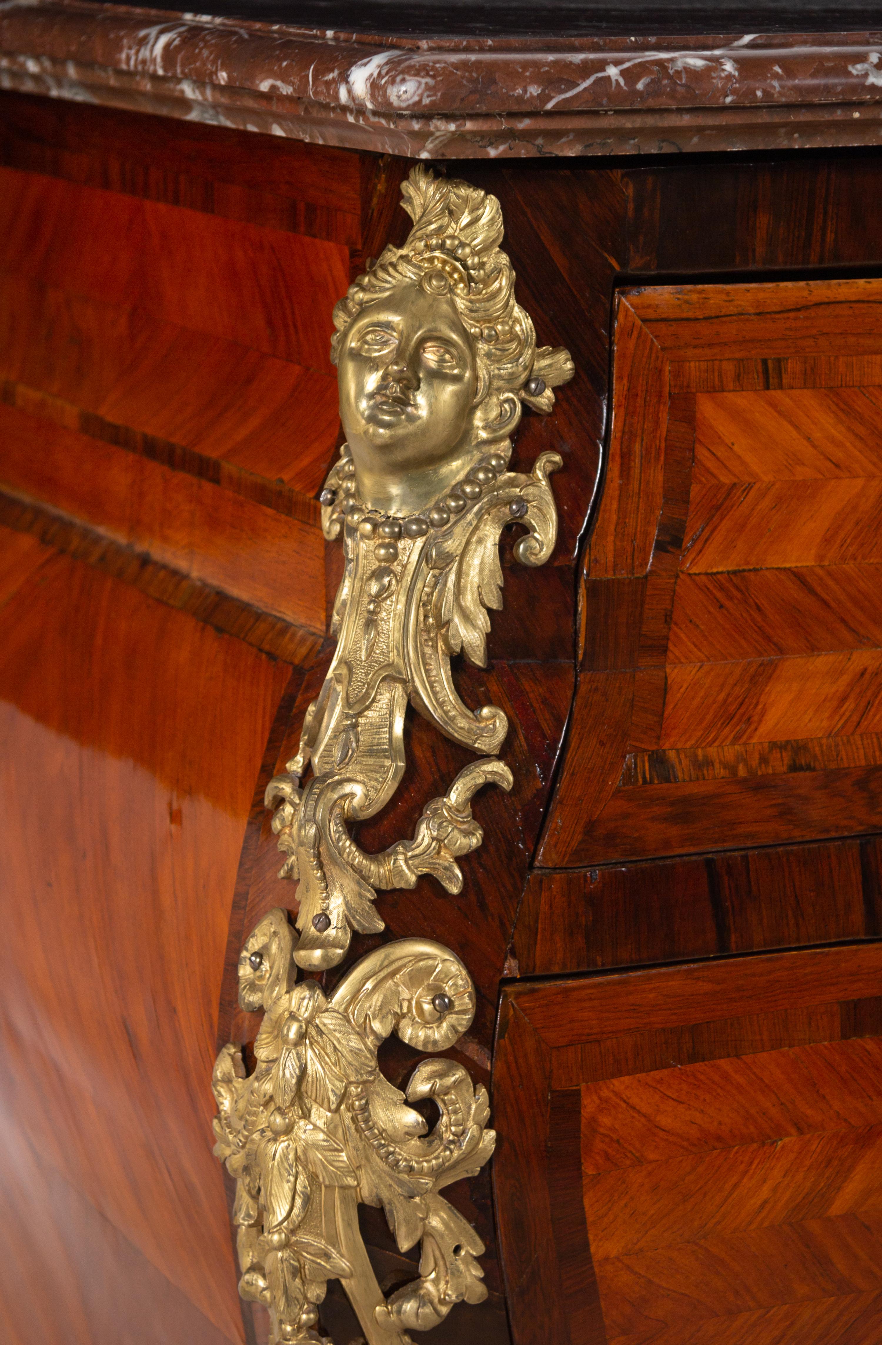 A Régence Style Gilt Bronze Mounted Parquetry Marble-Top Bombe Commode