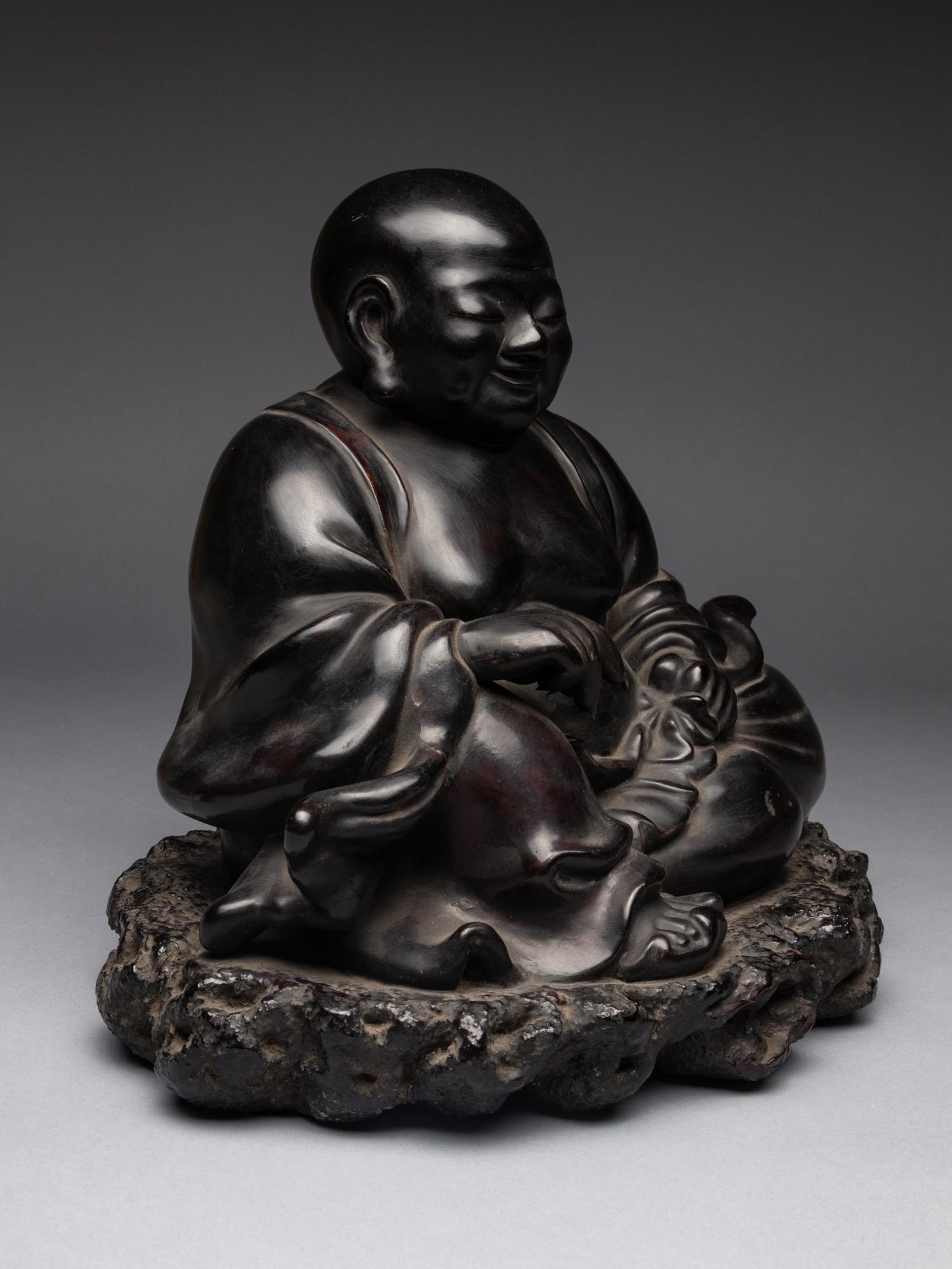 A Black Lacquered 'Jiazhu' Figure of Budai Buddha
