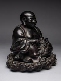 A Black Lacquered 'Jiazhu' Figure of Budai Buddha