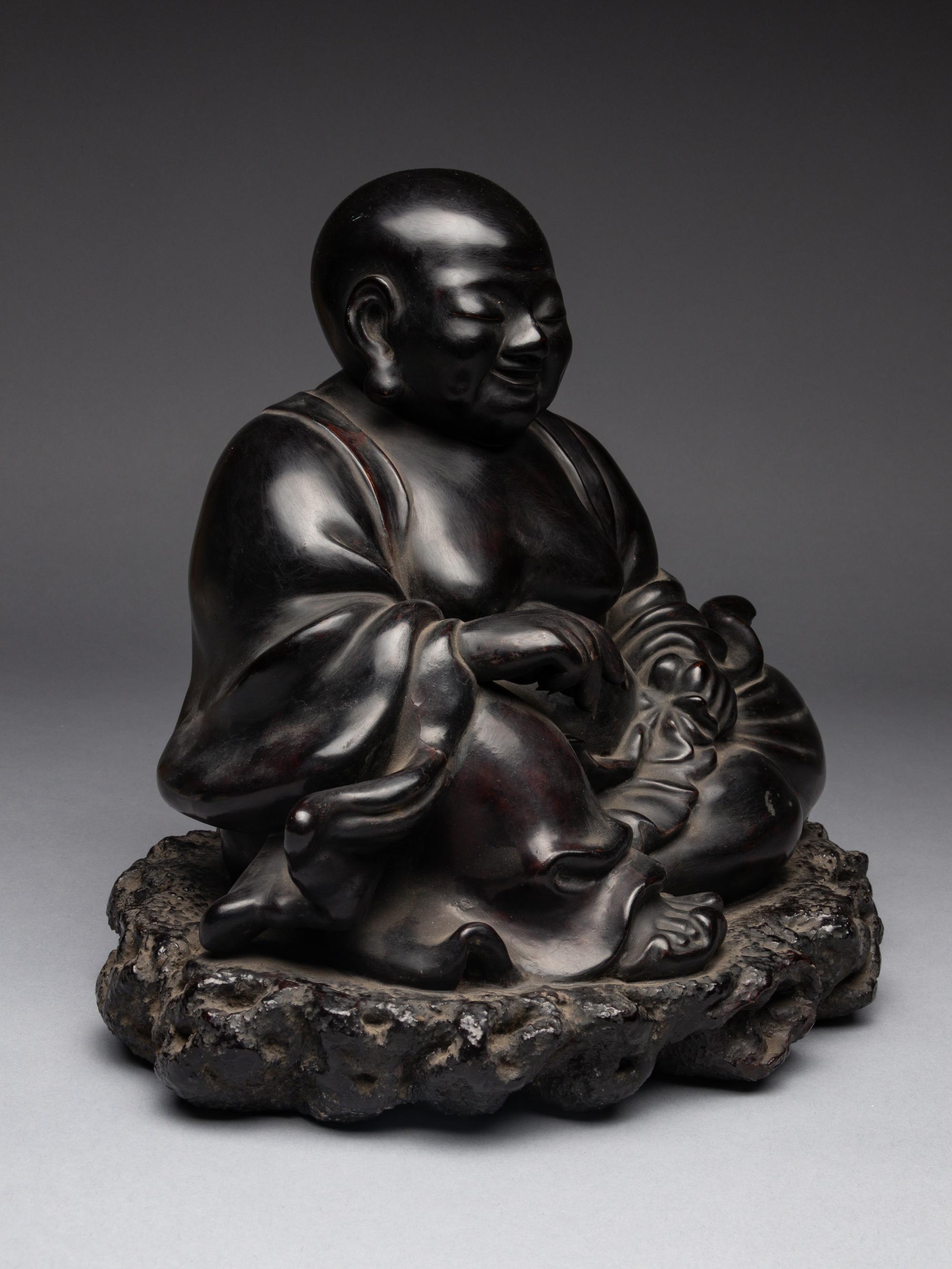 A Black Lacquered 'Jiazhu' Figure of Budai Buddha