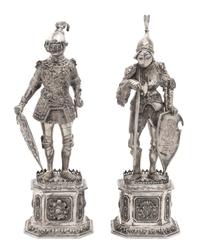 A Pair of German Hanau Silver Knights, 19TH CENTURY, depicting knights in full armor standing on pedestal bases.