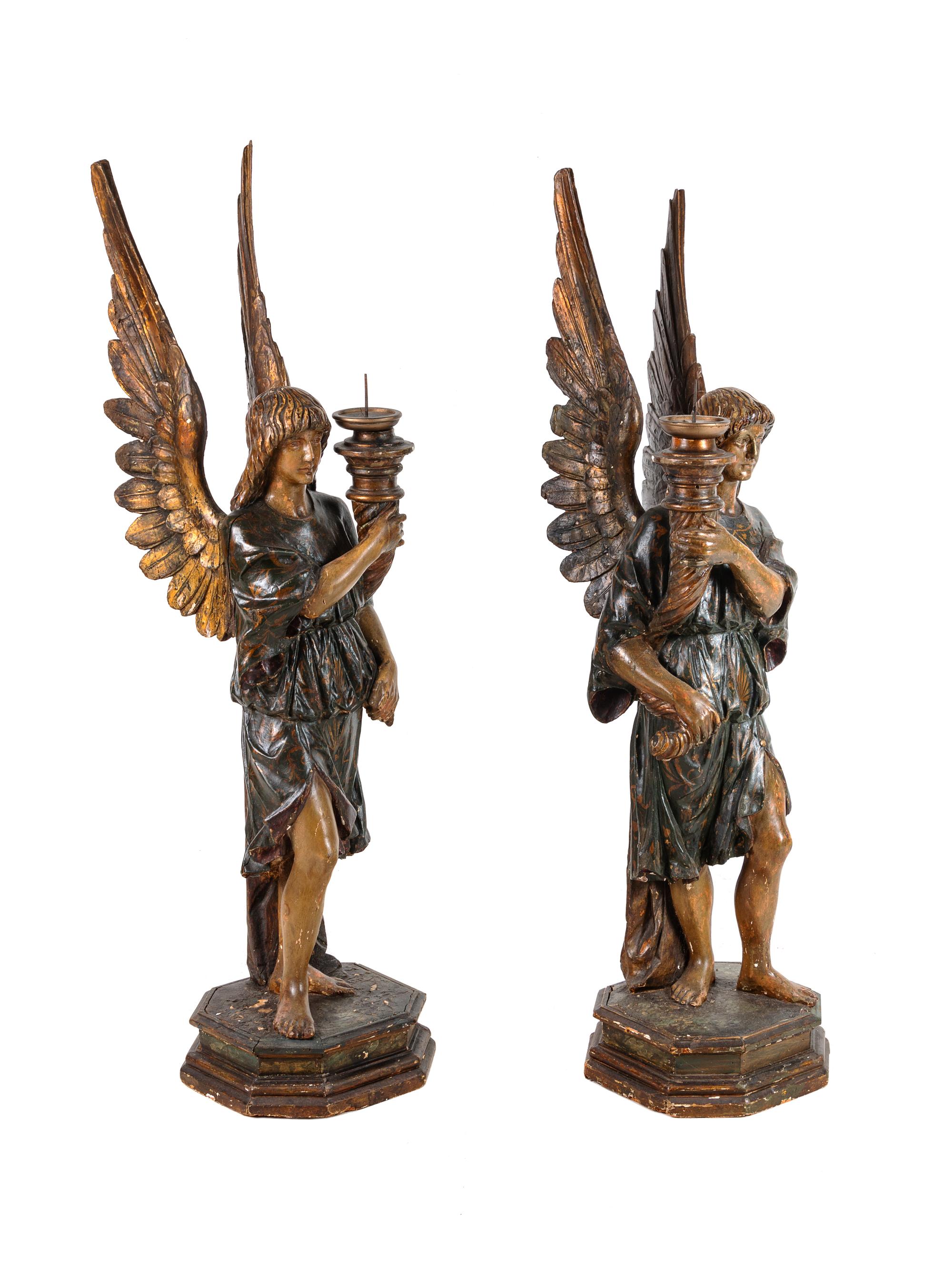 A Pair of Continental Carved and Painted Figural Prickets with Associated Pedestals