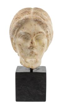 A Roman Marble Portrait Head of a Woman Height 9 1/4 inches. — CIRCA EARLY TO MID 3RD CENTURY C.E.