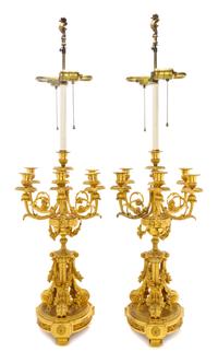 A Pair of Louis XVI Style Gilt Bronze Seven-Light Candelabra, Height 23 inches.