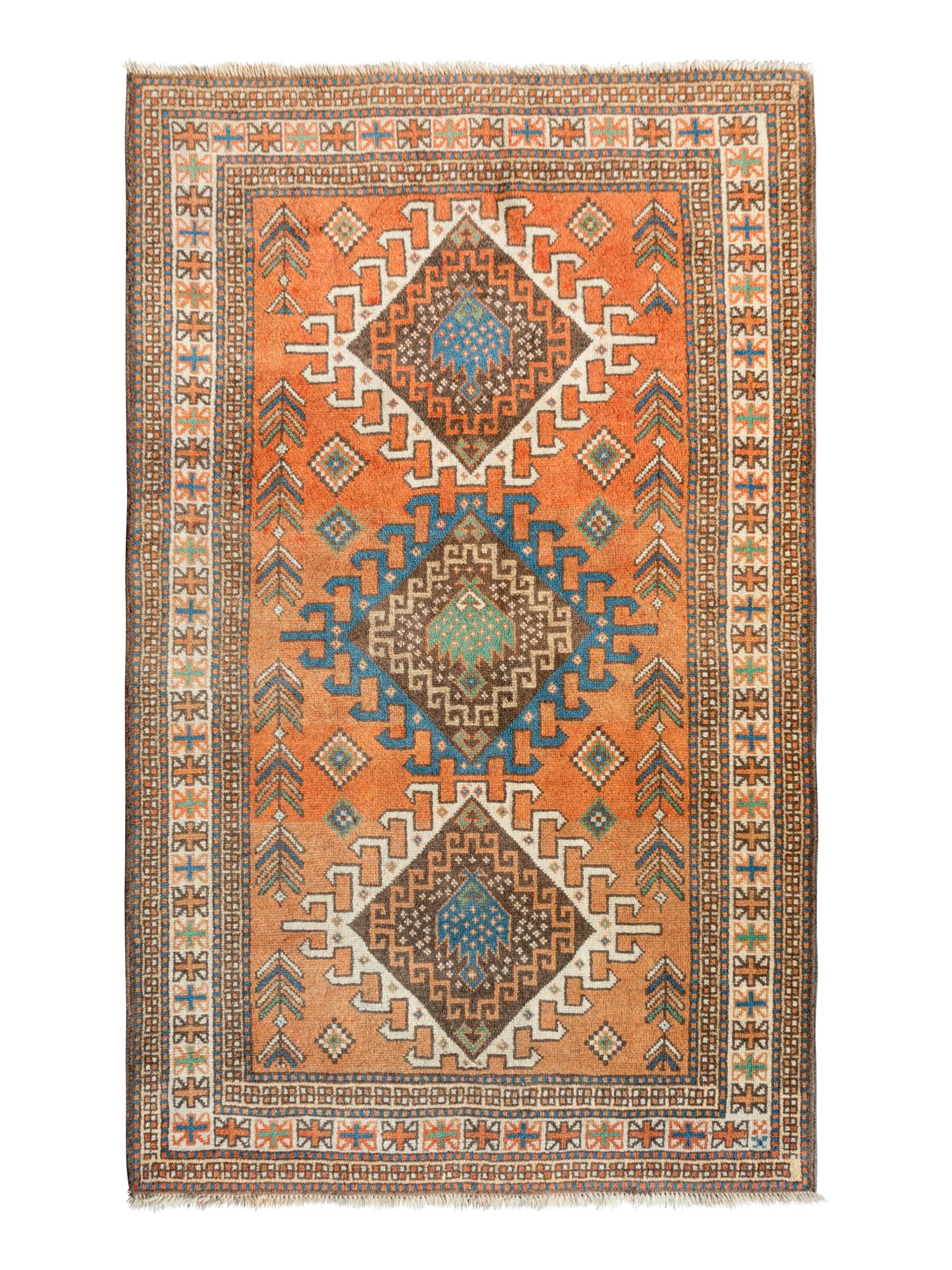 An Anatolian Wool Rug — 20TH CENTURY