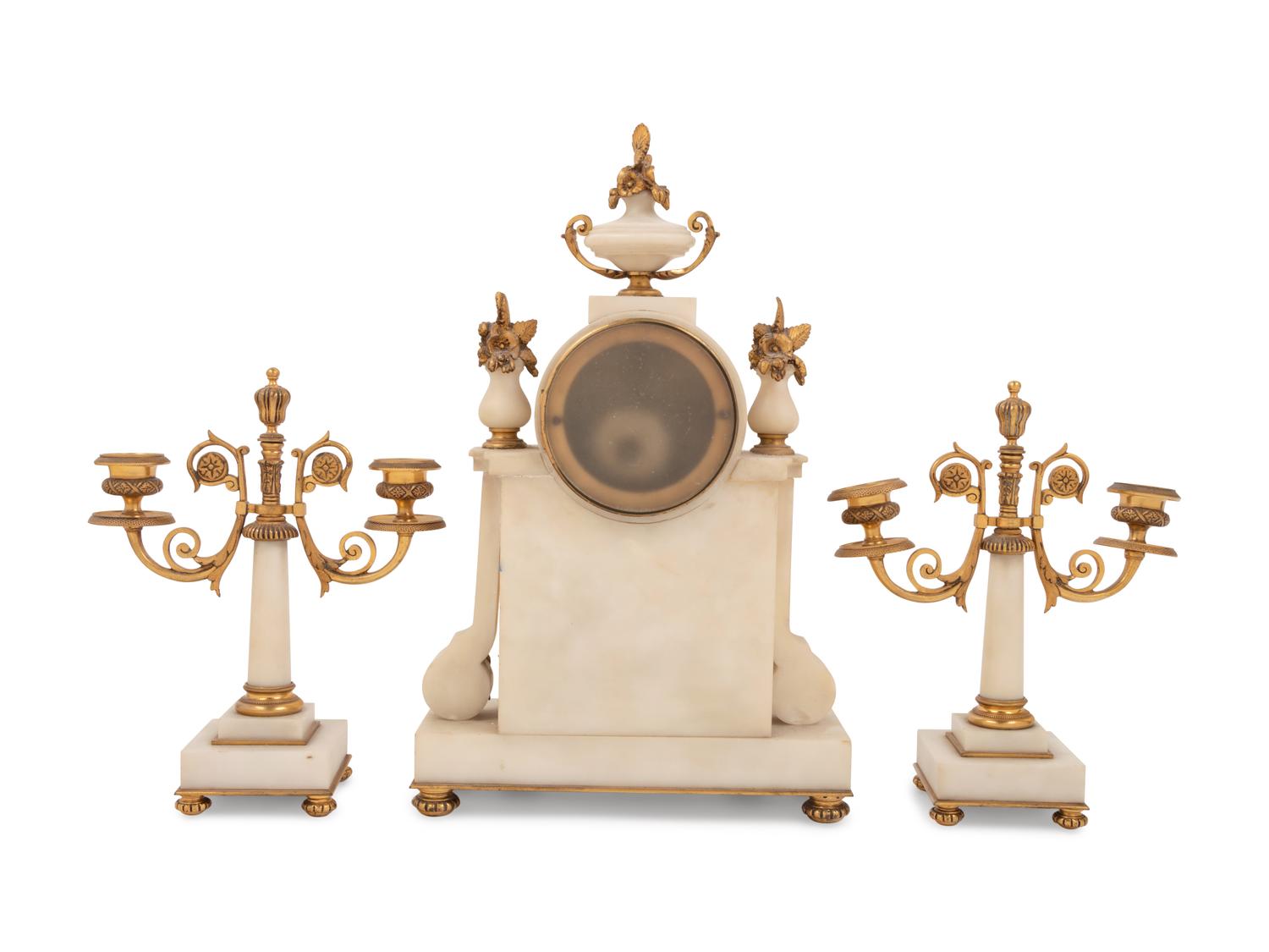 A Louis XVI Style Gilt Bronze Mounted Clock Garniture