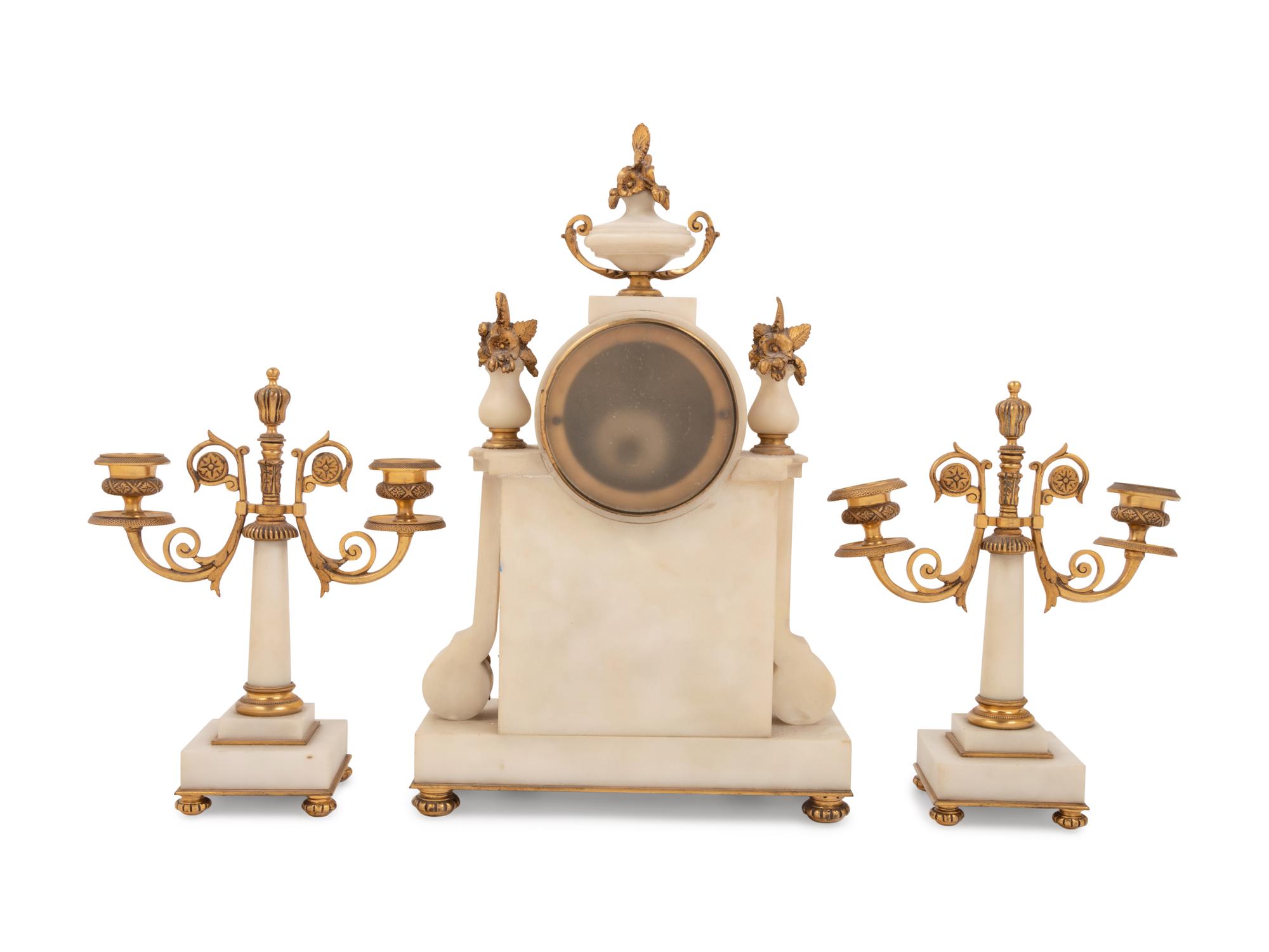 A Louis XVI Style Gilt Bronze Mounted Clock Garniture