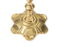 A Group of Four George III Brass Candlesticks