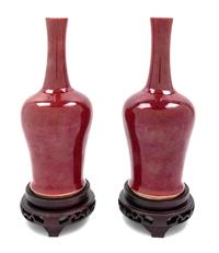 A Pair of Chinese Sang de Boeuf Porcelain Vases Height of porcelain 9 1/8 inches. — 20TH CENTURY