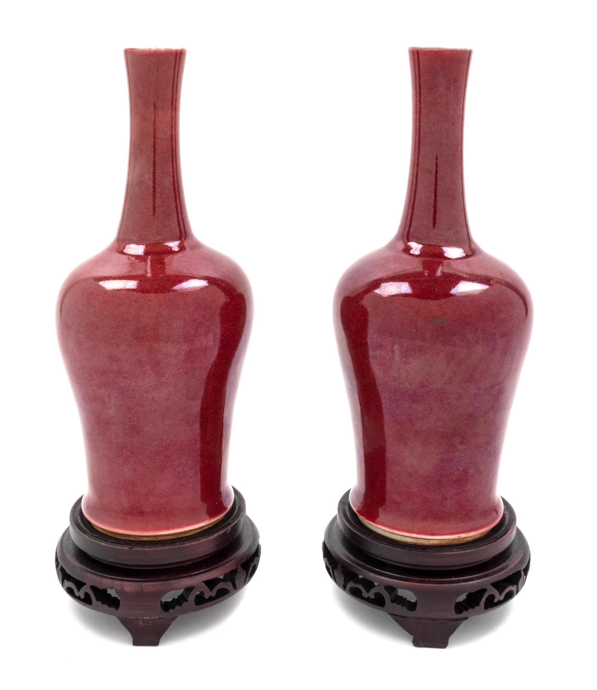 A Pair of Chinese Sang de Boeuf Porcelain Vases Height of porcelain 9 1/8 inches. — 20TH CENTURY
