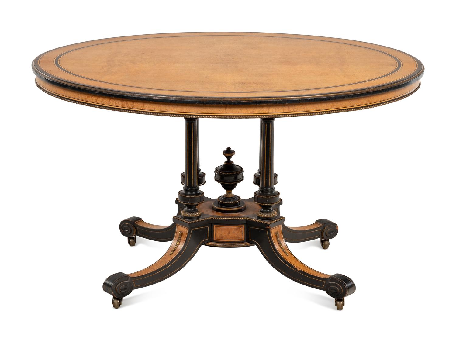 A Continental Parcel Ebonized Center Table