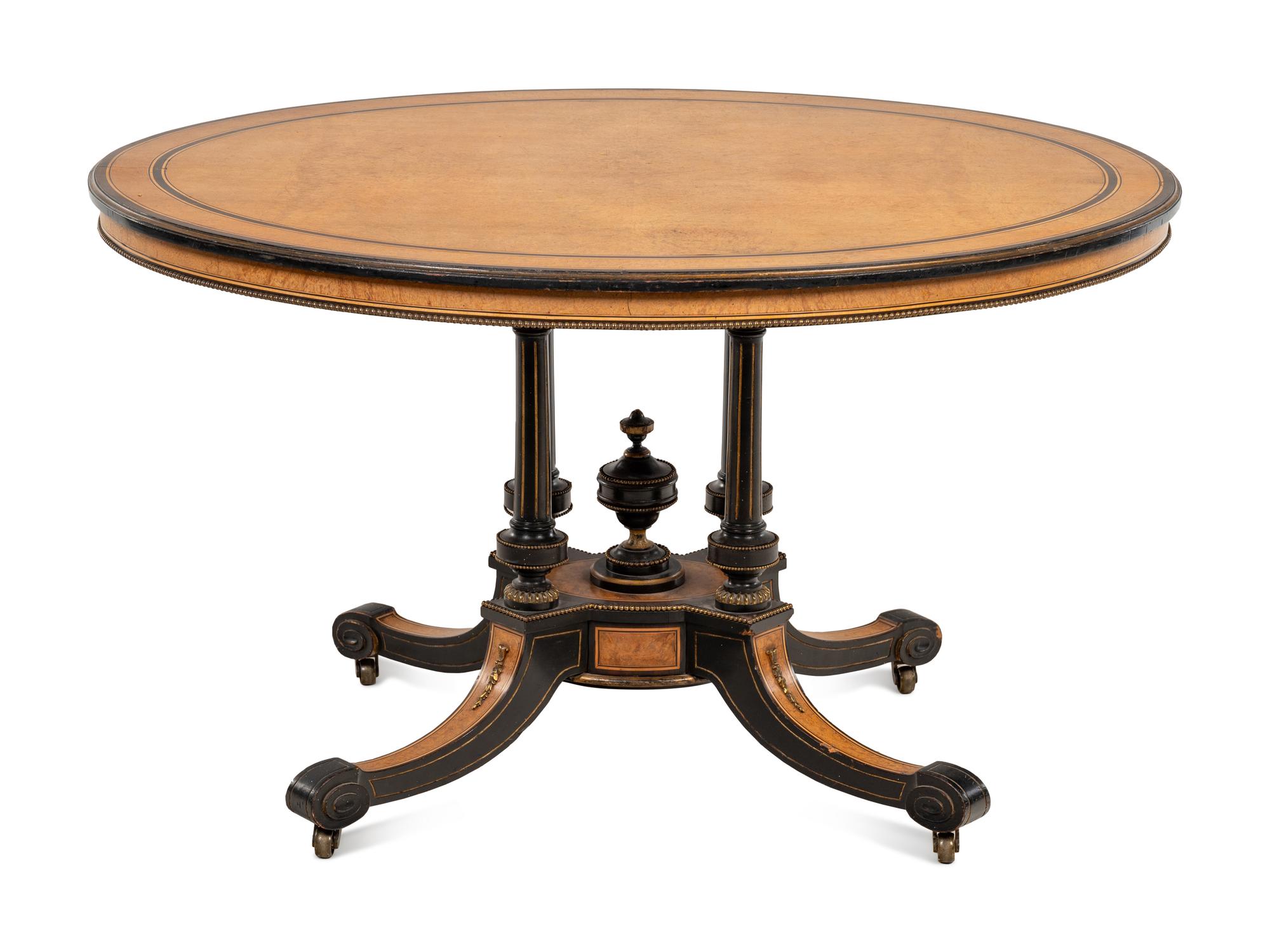A Continental Parcel Ebonized Center Table