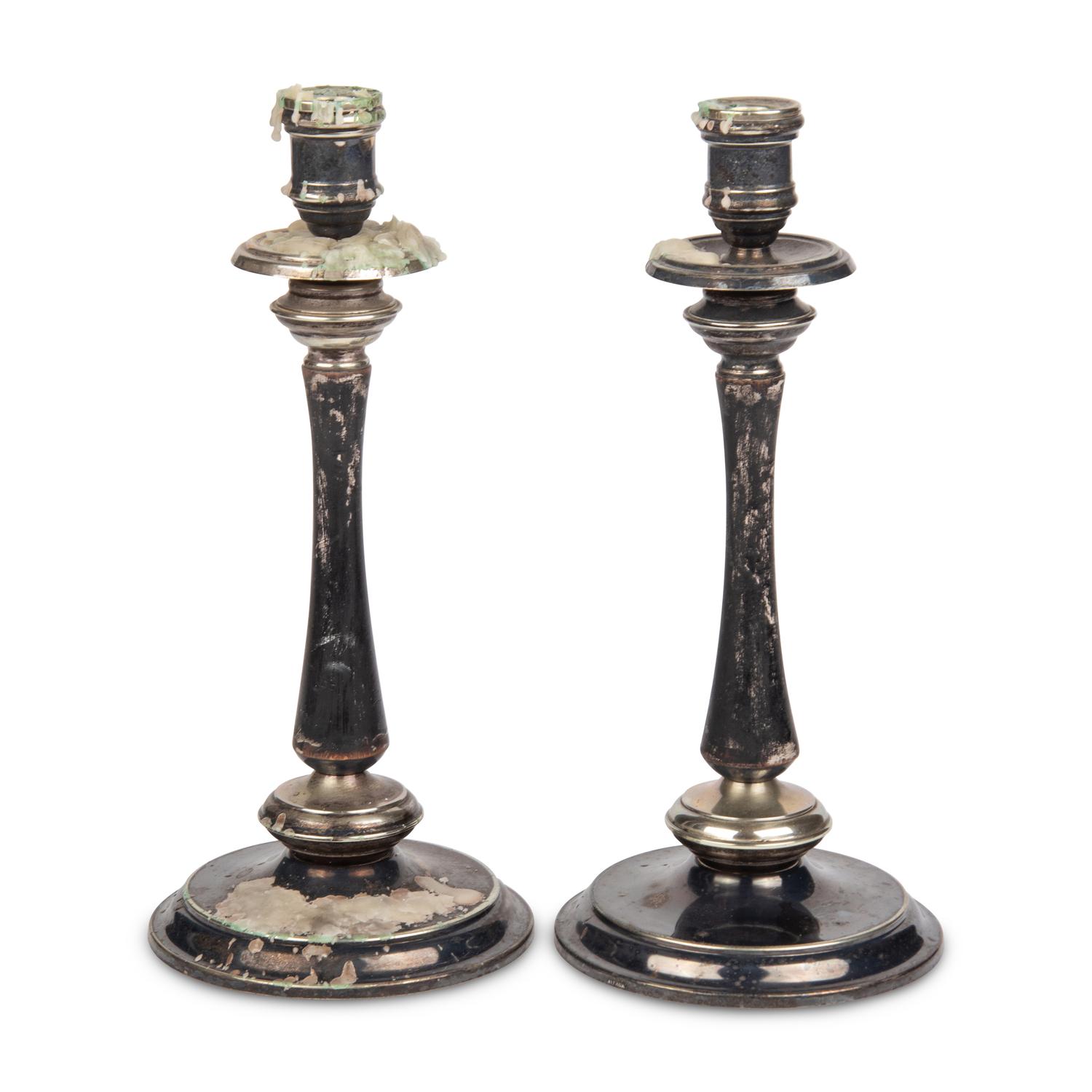 A Pair of Alpaca Silver and Black-Painted Wood Candlesticks
