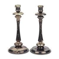 A Pair of Alpaca Silver and Black-Painted Wood Candlesticks