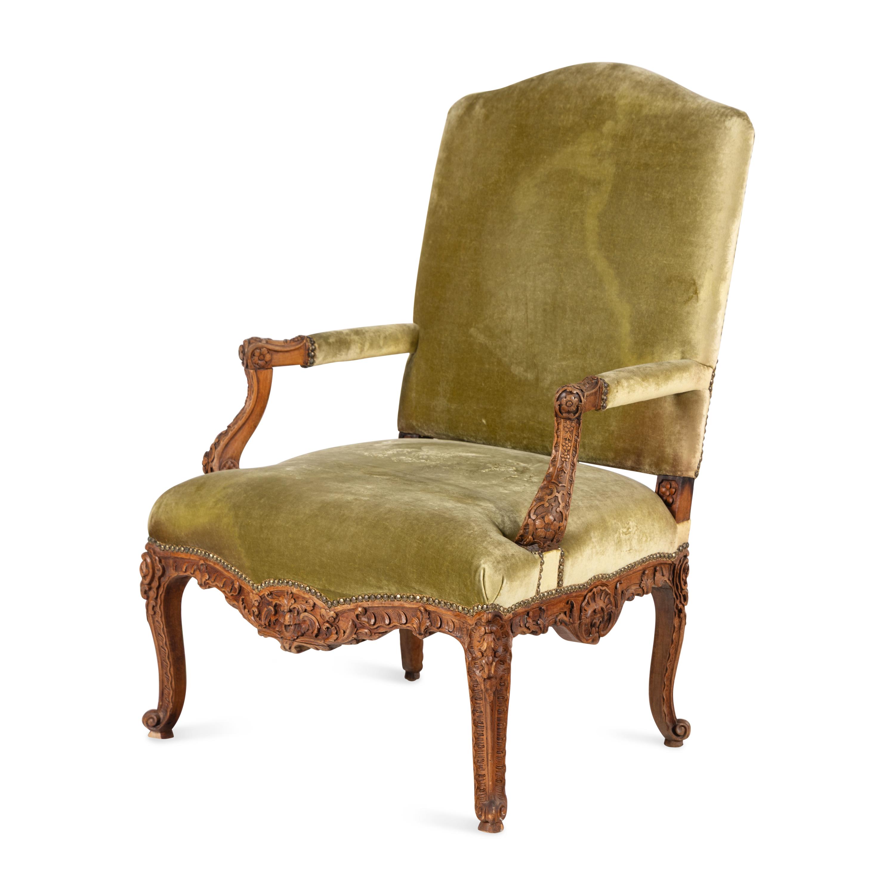 A Louis XV Style Carved Walnut Fauteuil