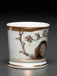 A Porcelain Occupational Shaving Mug Depicting a Bushel of Oysters