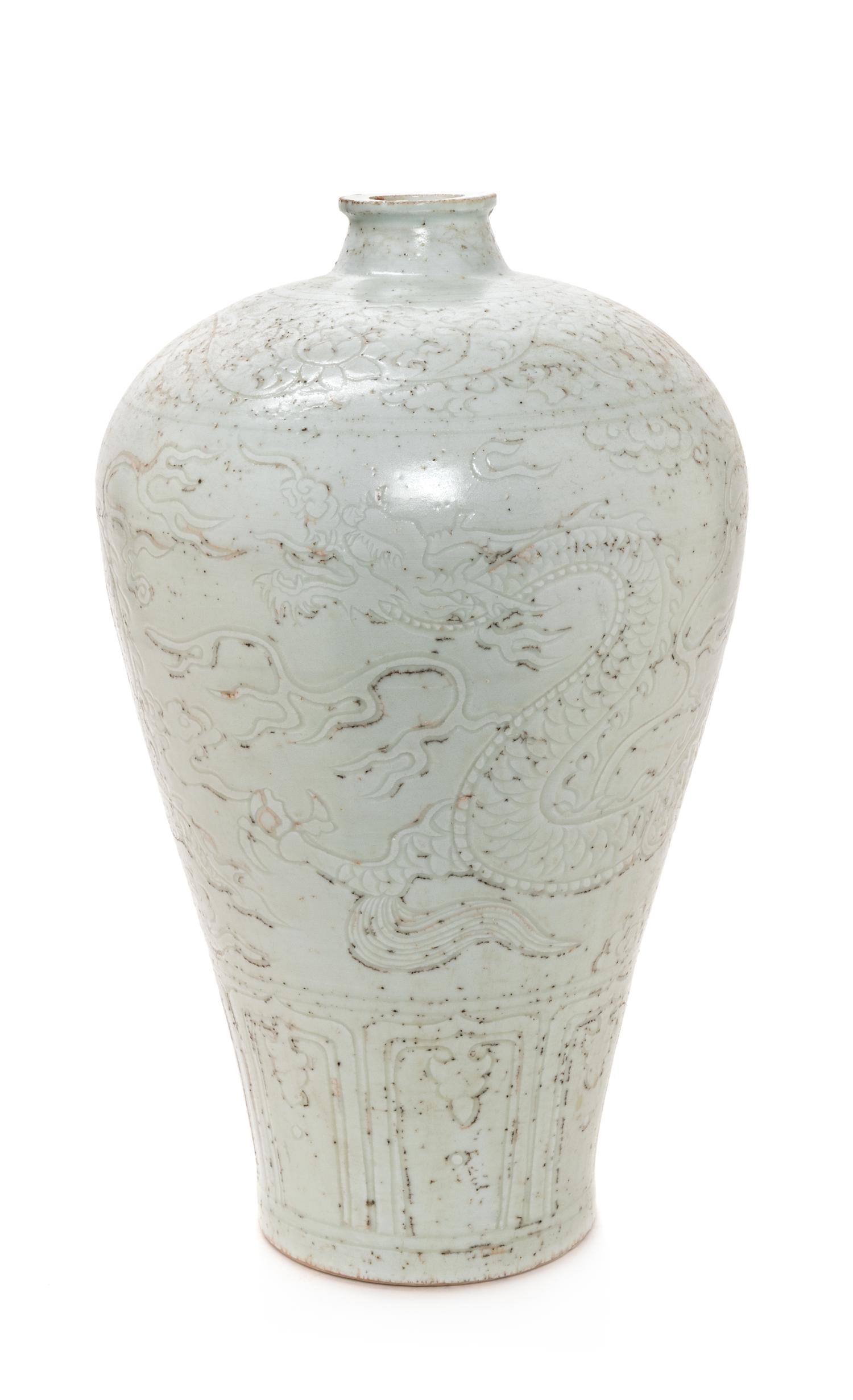 A Chinese Carved White Glazed Porcelain Meiping Vase Height 17 inches. — 20TH CENTURY