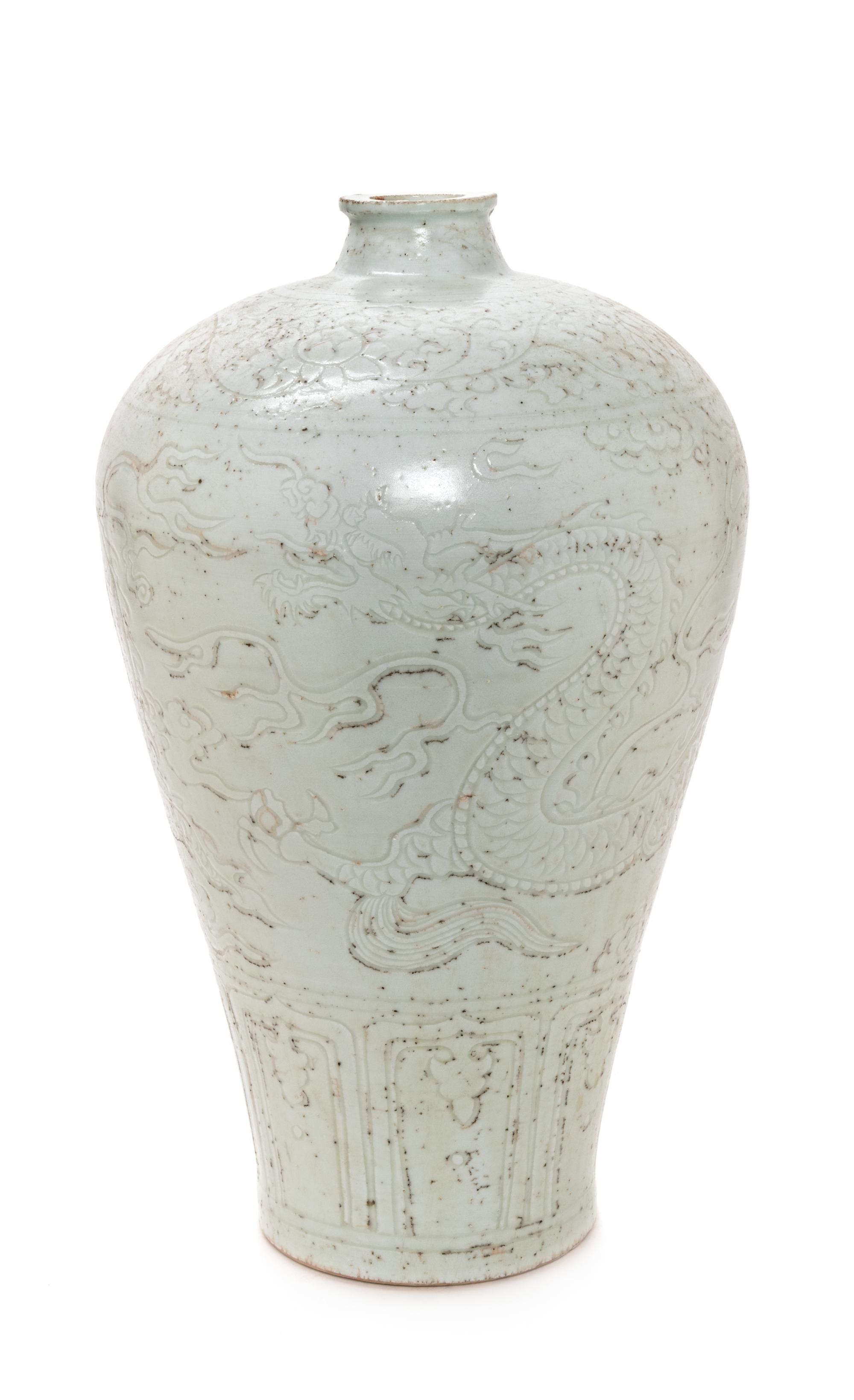 A Chinese Carved White Glazed Porcelain Meiping Vase Height 17 inches. — 20TH CENTURY
