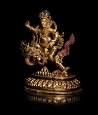 A Sino-Tibetan Gilt Bronze Figure of Kubera