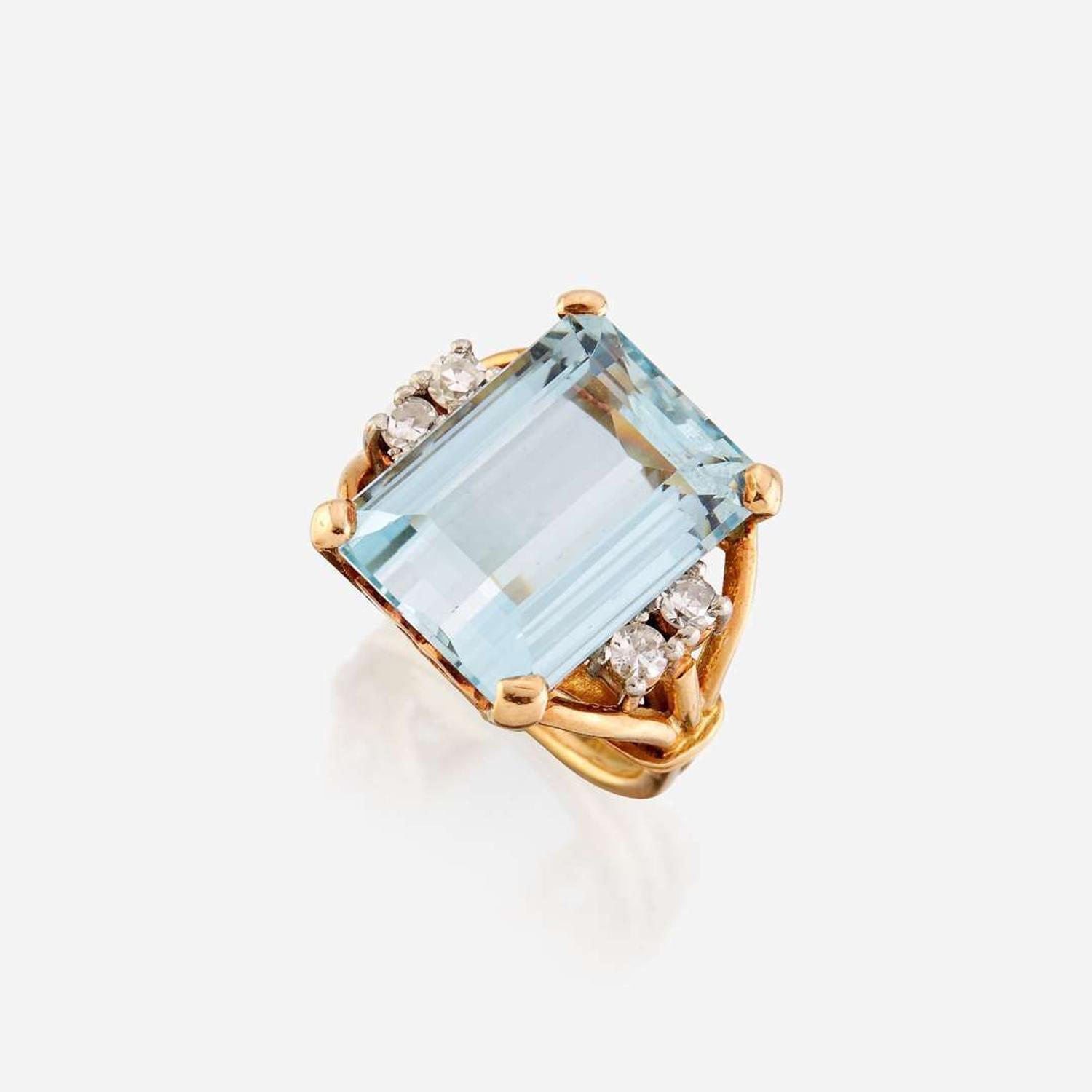 An aquamarine, diamond, and eighteen karat gold ring