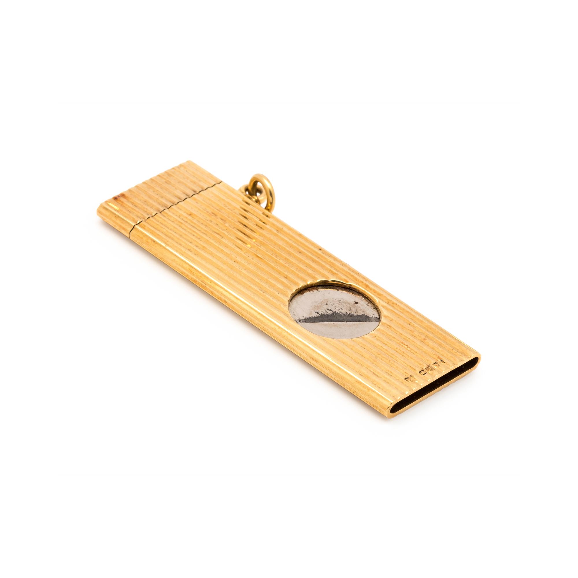 KUTCHINSKY, YELLOW GOLD AND STEEL CIGARETTE CUTTER