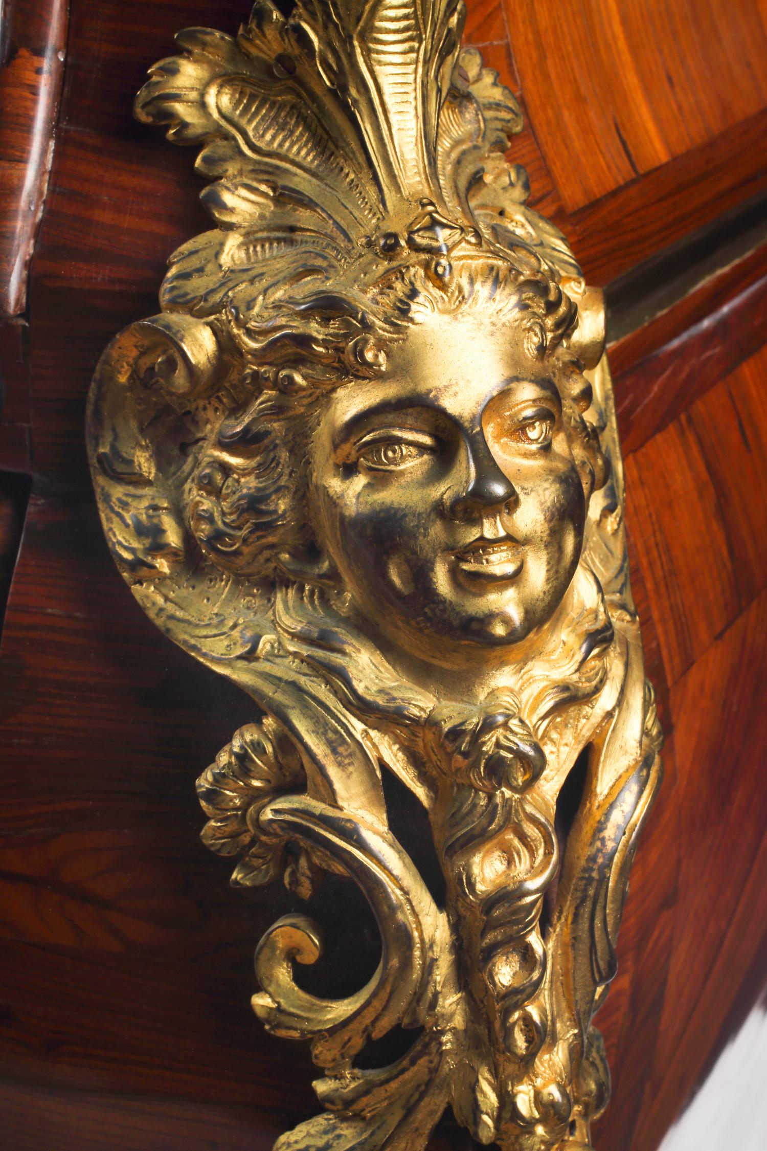 A Régence Gilt Bronze Mounted Marquetry Marble-Top Commode