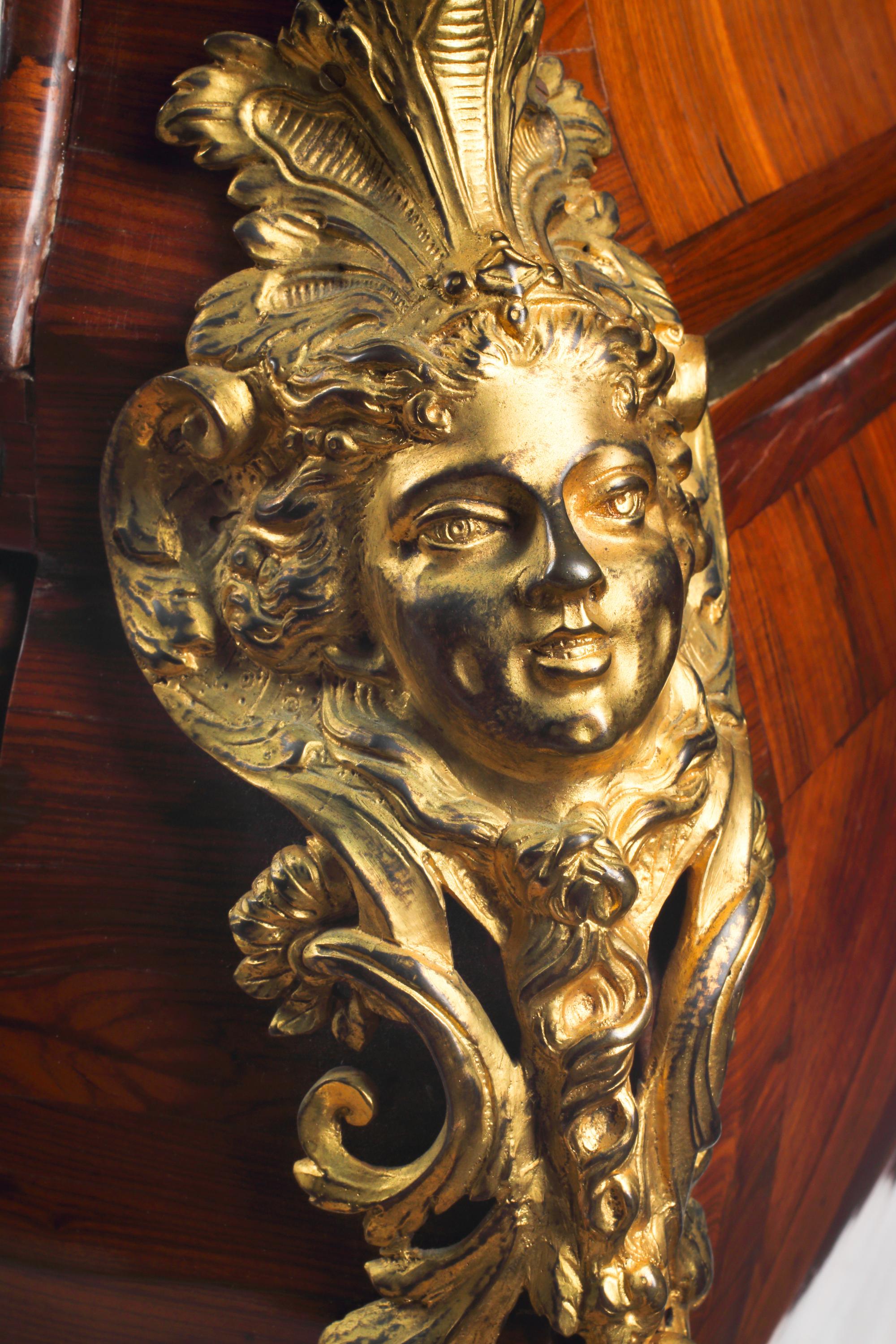 A Régence Gilt Bronze Mounted Marquetry Marble-Top Commode