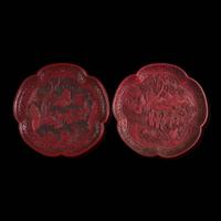 An associated pair of Chinese carved cinnabar lacquer dishes, and a small circular box 大漆 盘子或一对及一小盖盒