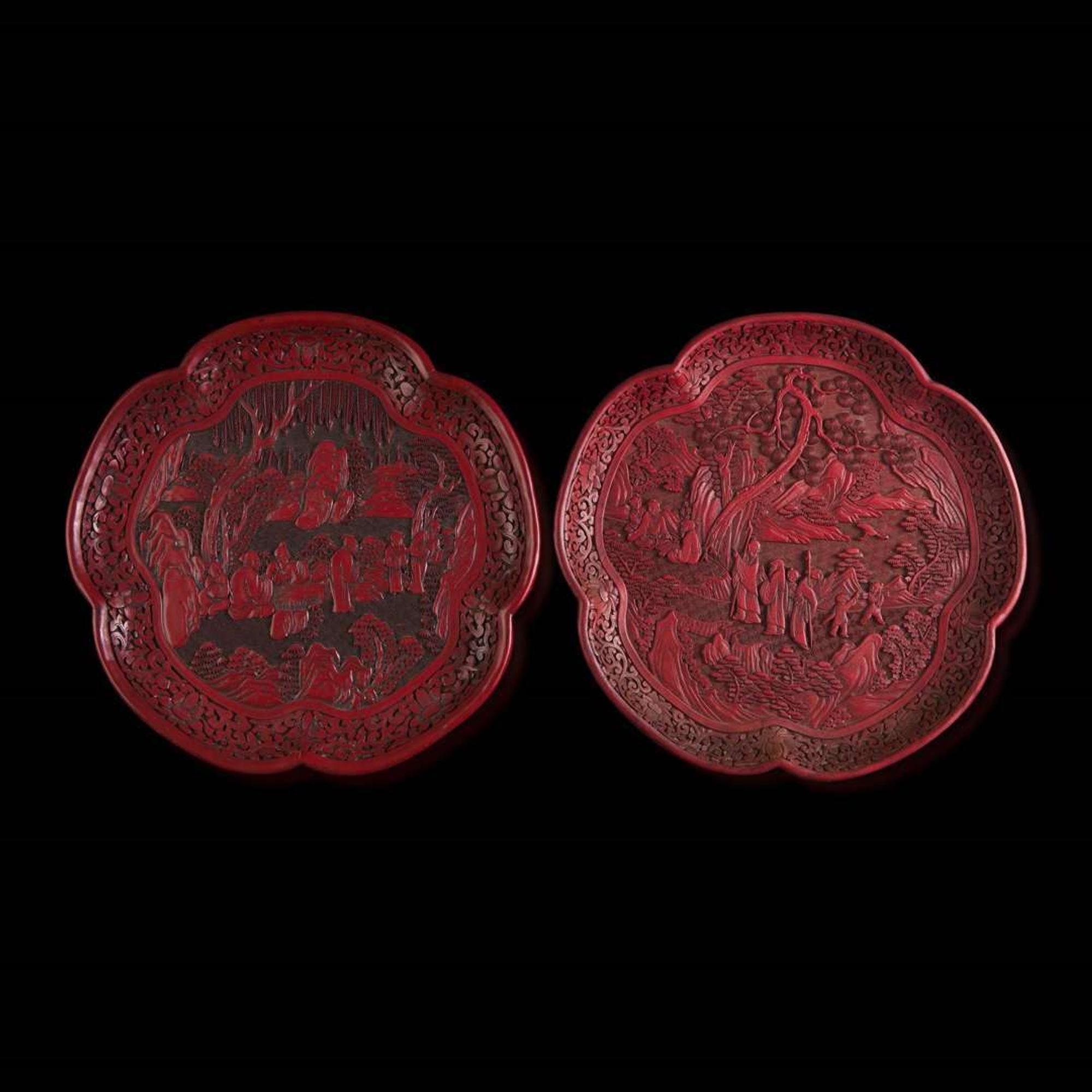 An associated pair of Chinese carved cinnabar lacquer dishes, and a small circular box 大漆 盘子或一对及一小盖盒