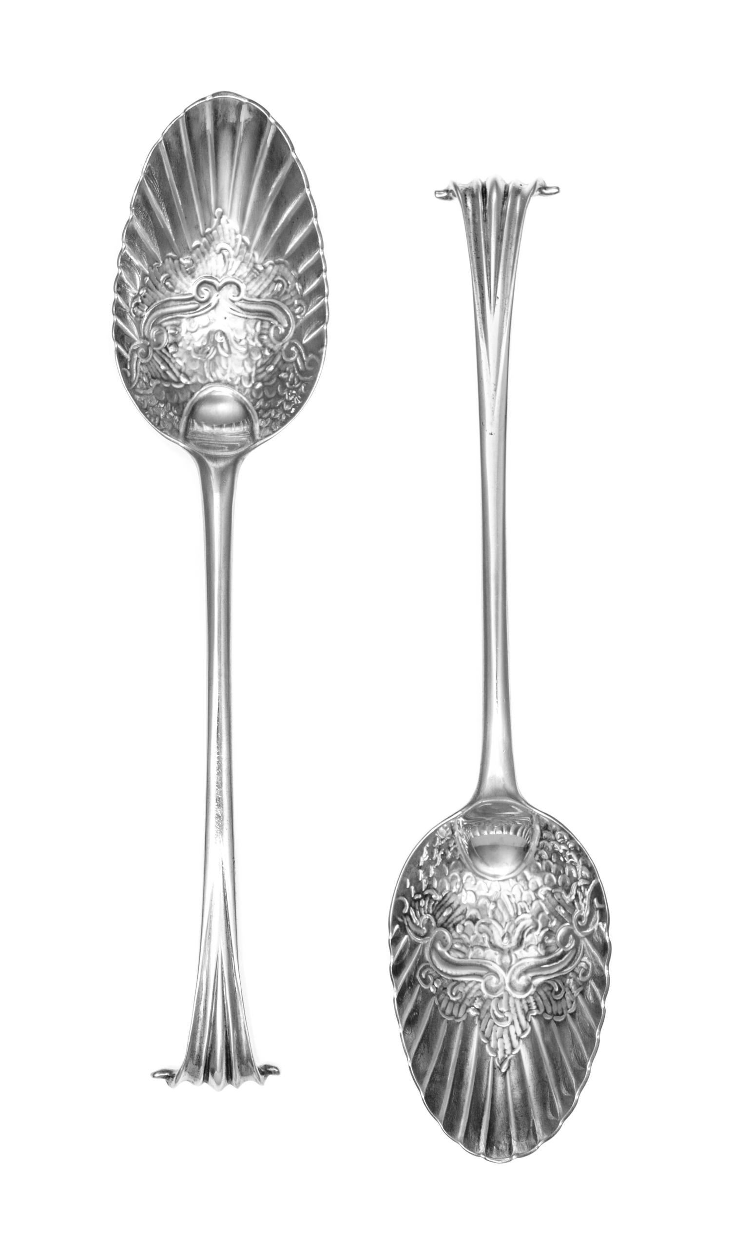 A Pair of George III Silver Berry Spoons, Hester Bateman, London, 1780, each having scroll handles with foliate and scale worked bowls,