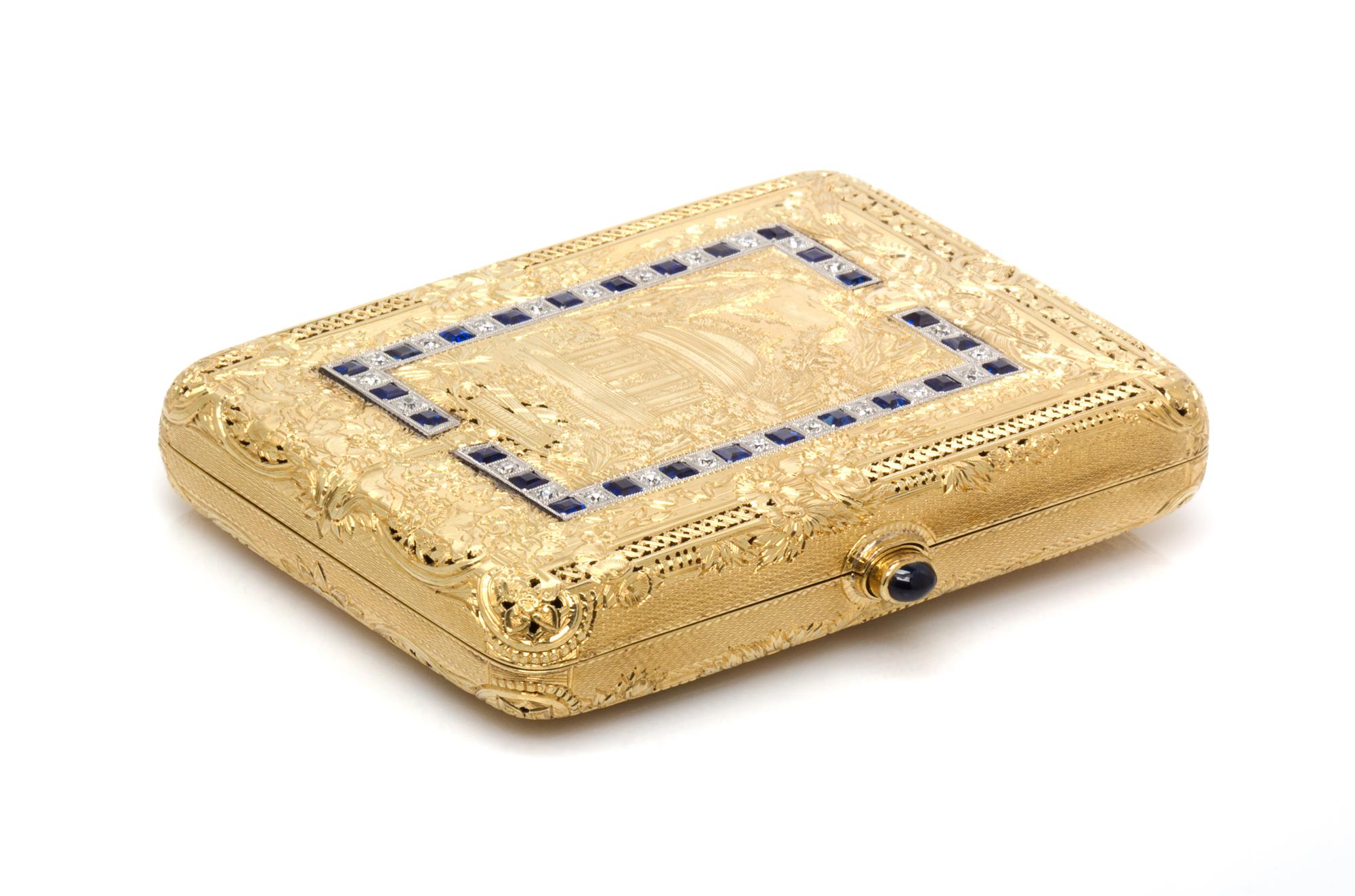 An 18 Karat Yellow Gold, Platinum, Ruby, Diamond and Sapphire Compact, 102.90 dwts.
