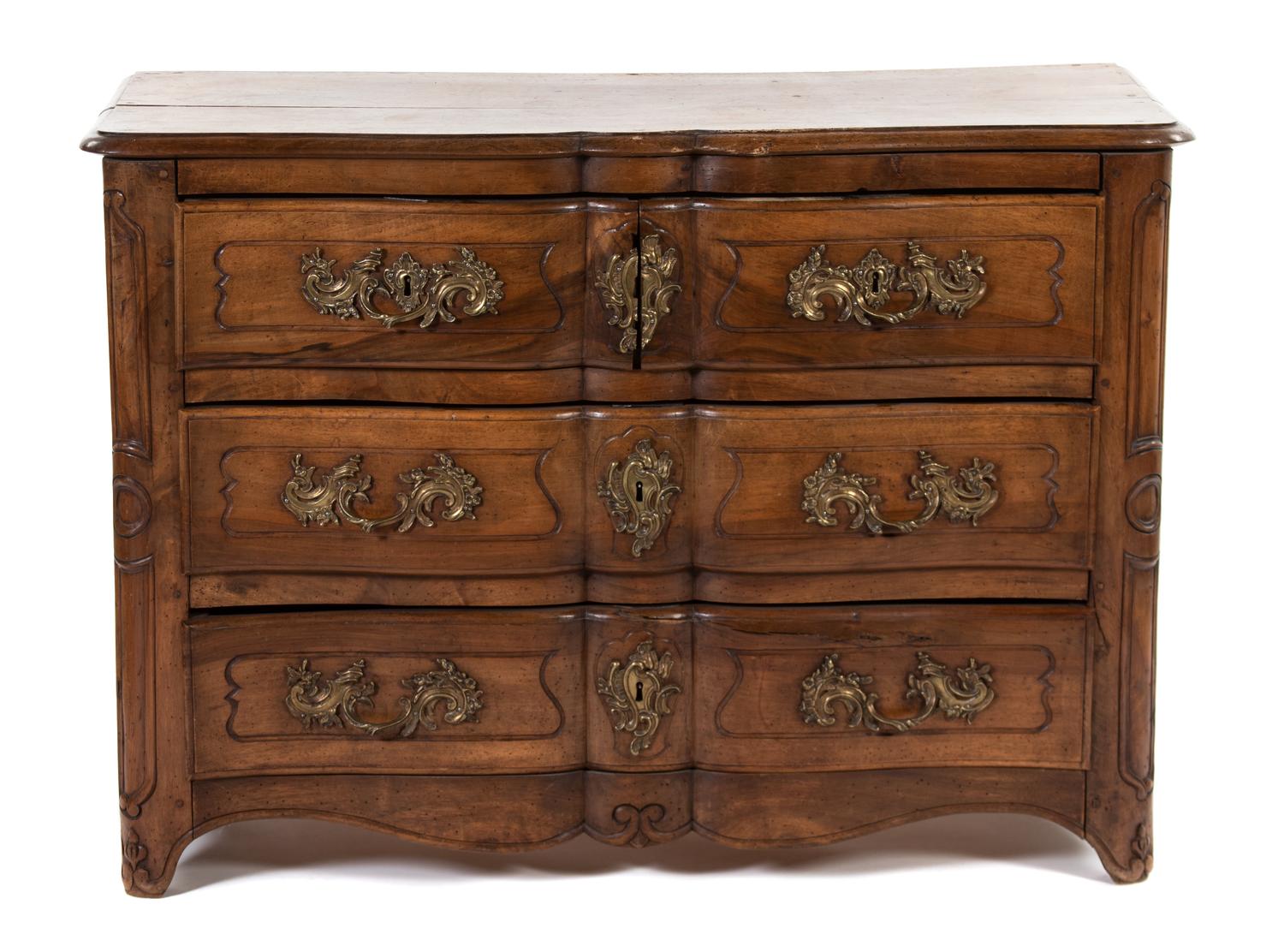 A Louis XV Provincial Style Walnut Commode
