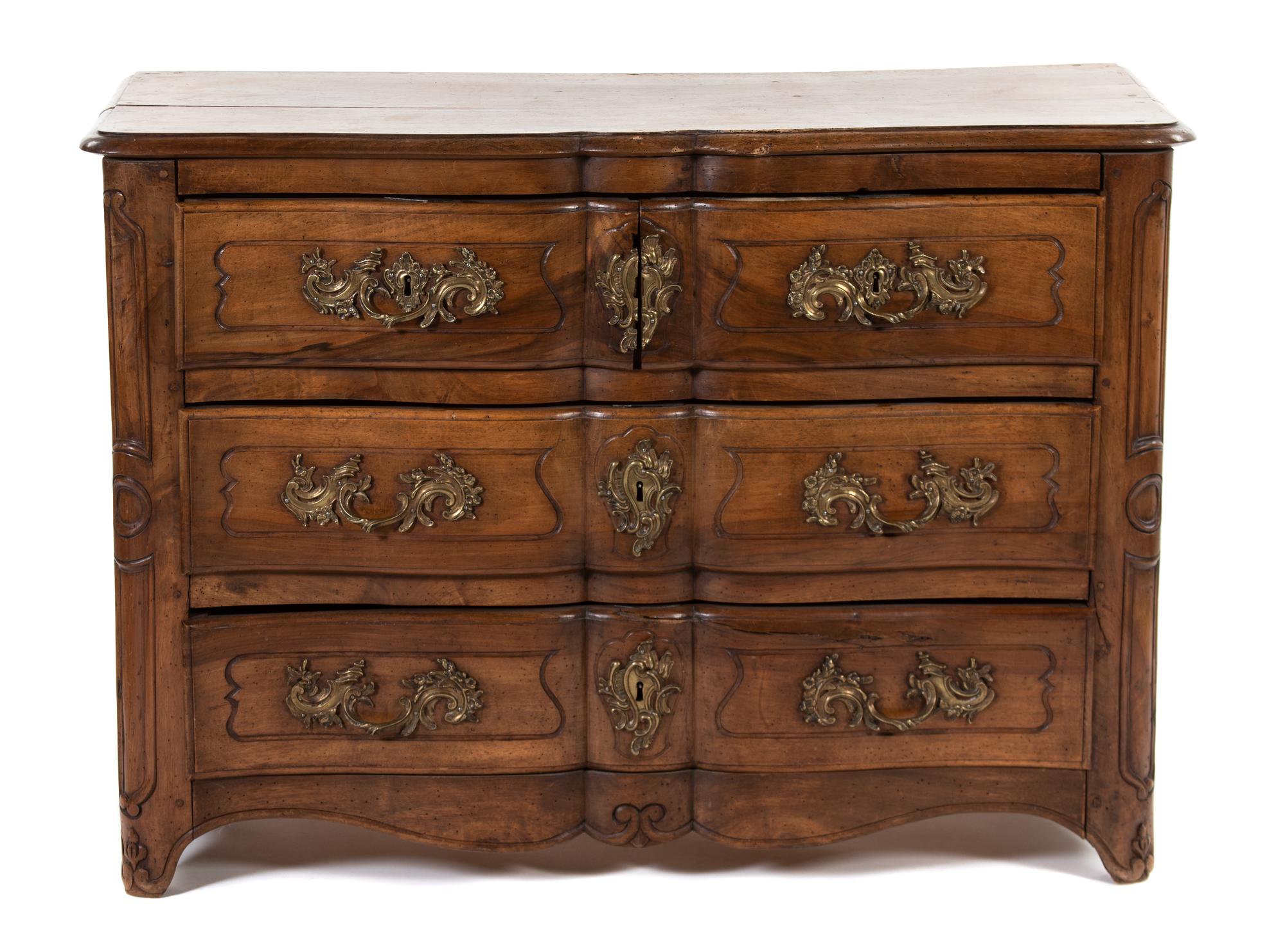 A Louis XV Provincial Style Walnut Commode