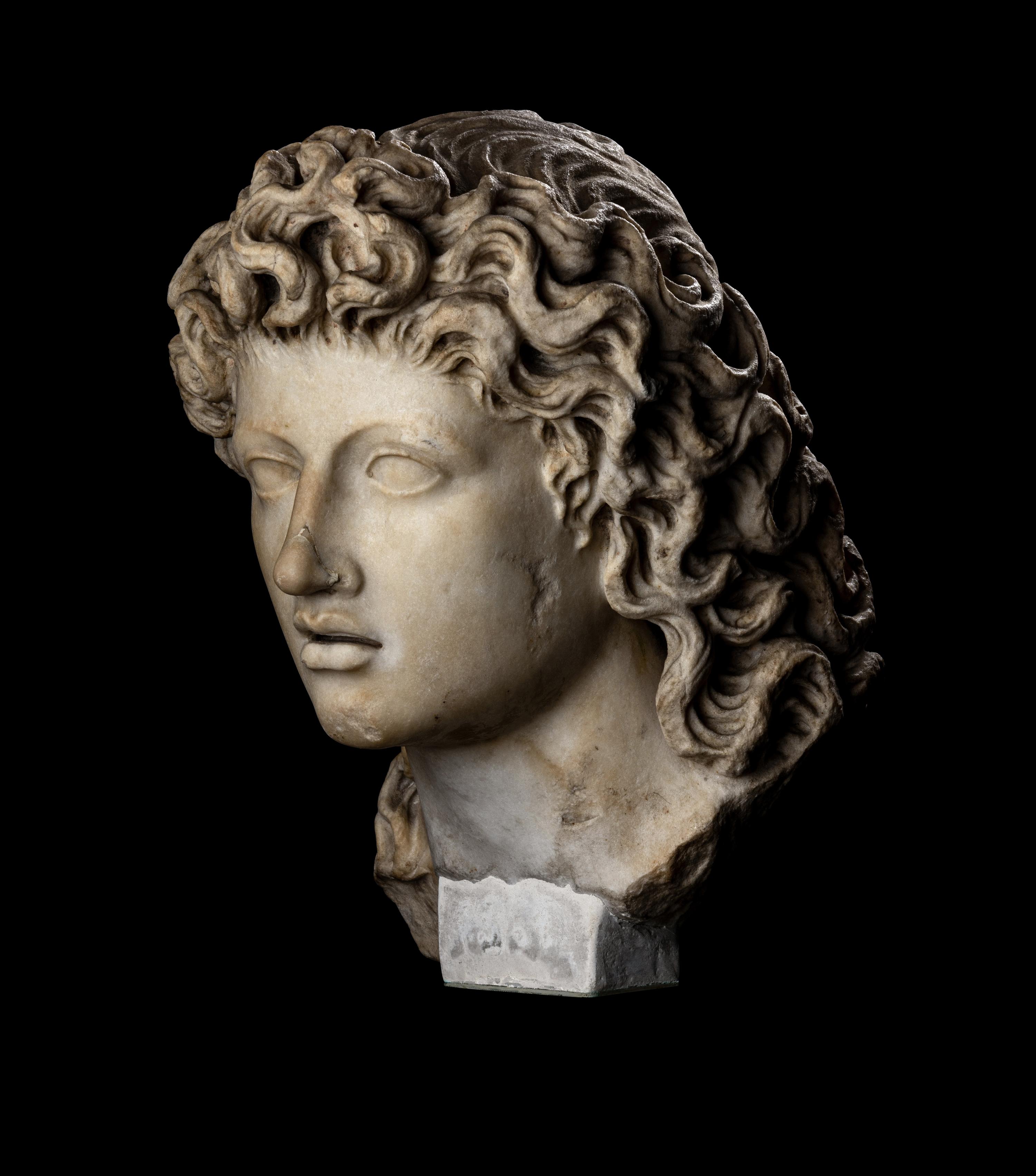 A Roman Marble Head of a Triton