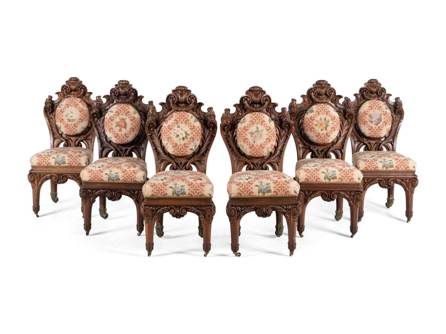 A Set of Six Rococo Revival Carved Oak Dining Chairs